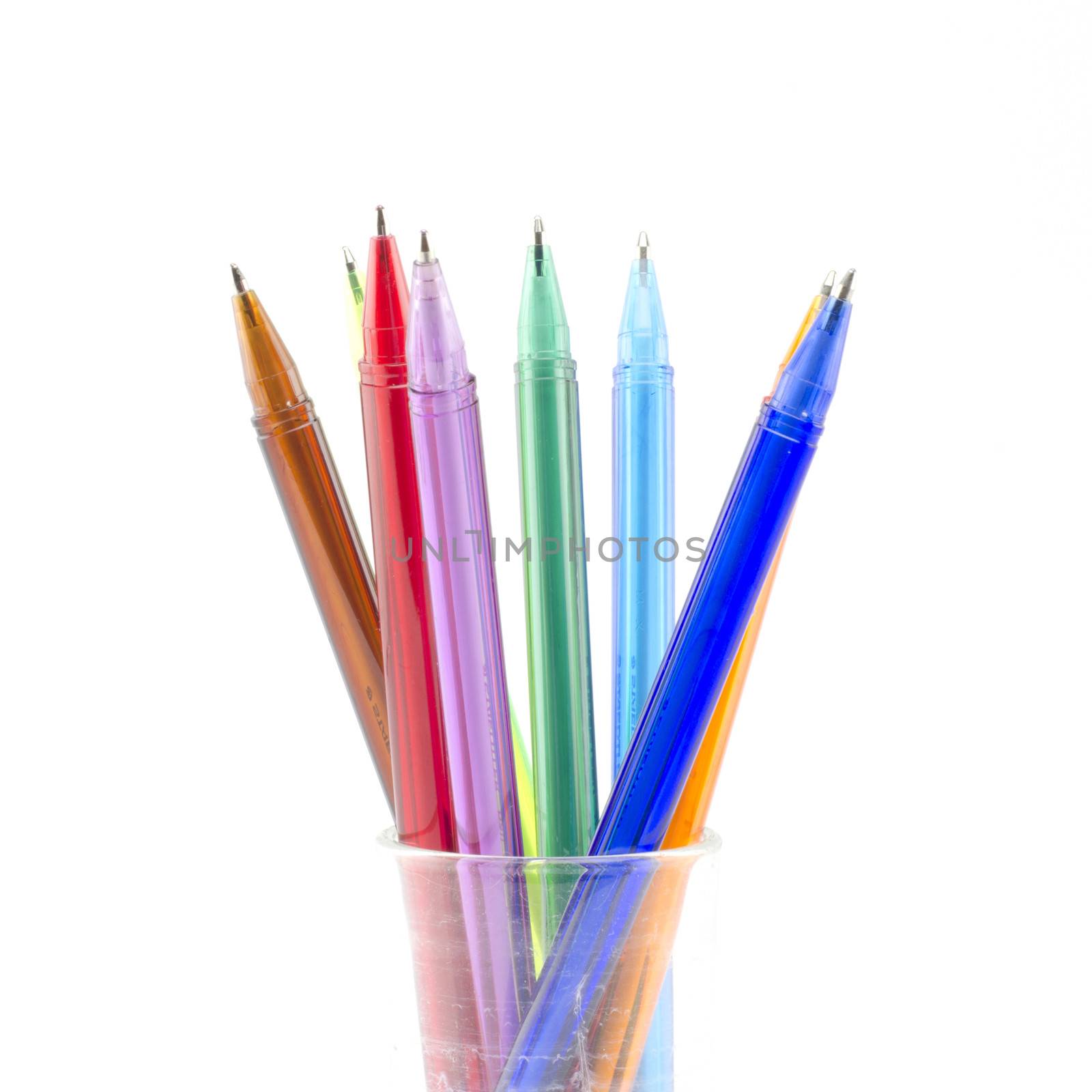 colorful pens isolated on white by ammza12