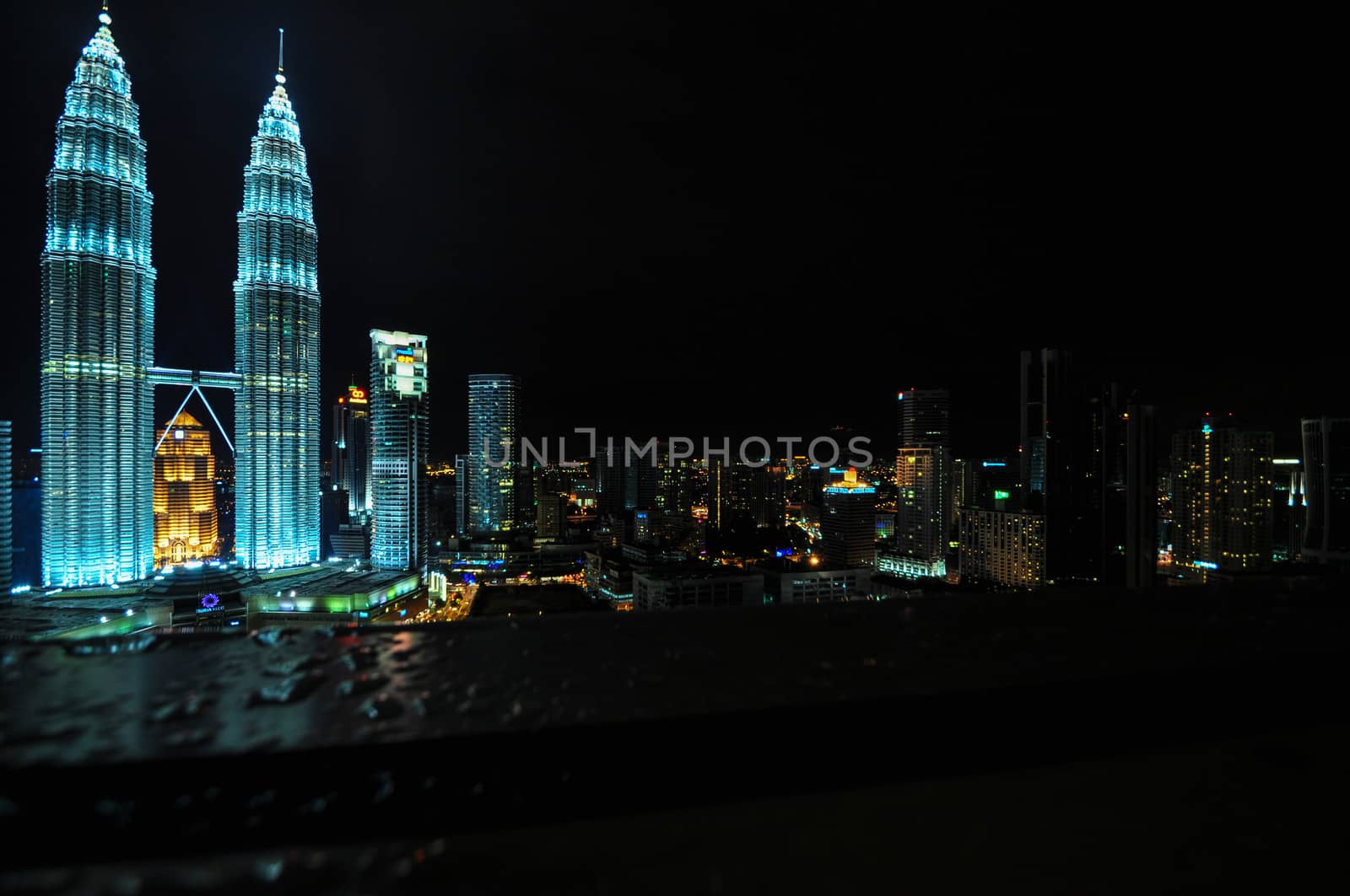 KUALA LUMPUR - APRIL 10: General view of Petronas Twin Towers  at night on Apr 10, 2011 in Kuala Lumpur, Malaysia. The towers are the worlds tallest twin towers with the height of 451.9m.