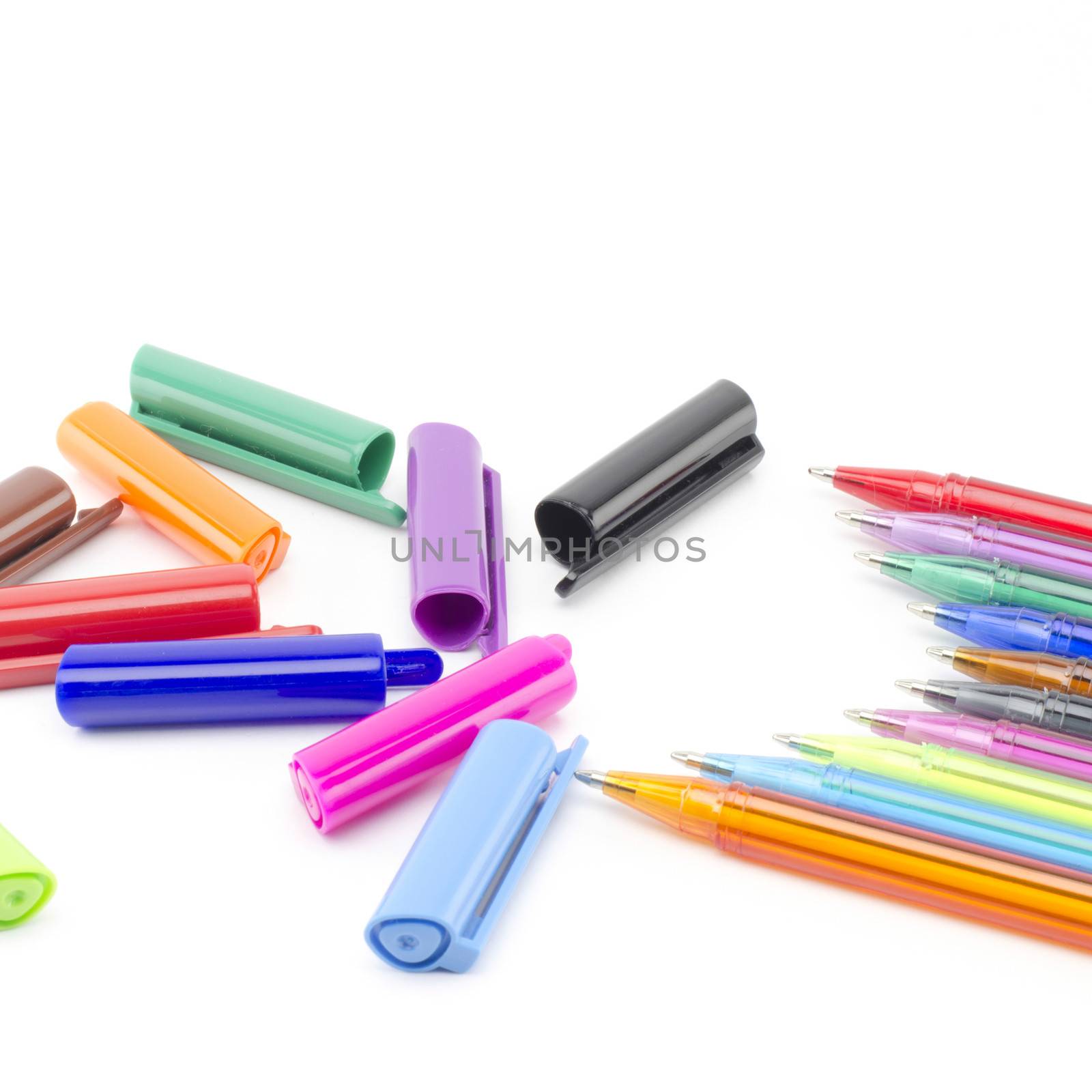 colorful pens isolated on white by ammza12