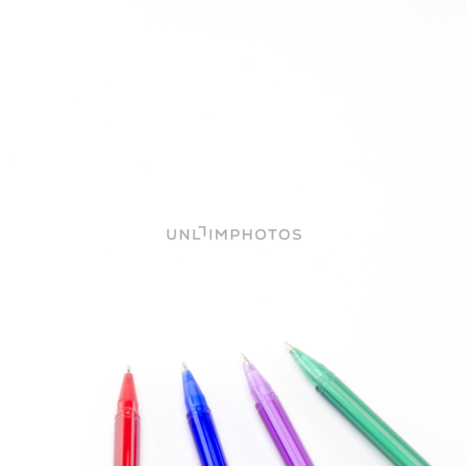 colorful pens isolated on white by ammza12