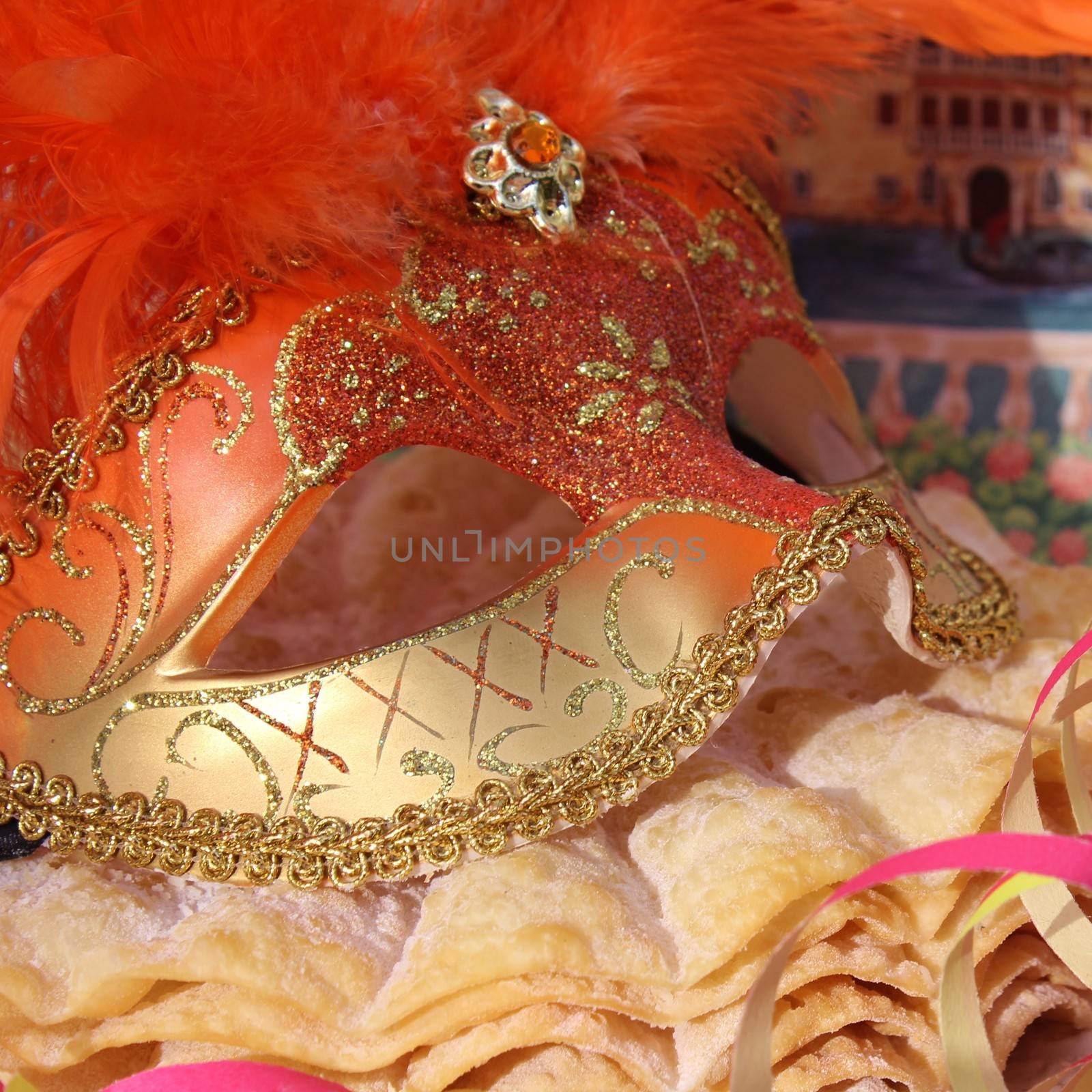 Orange carnival mask with gold with pancakes