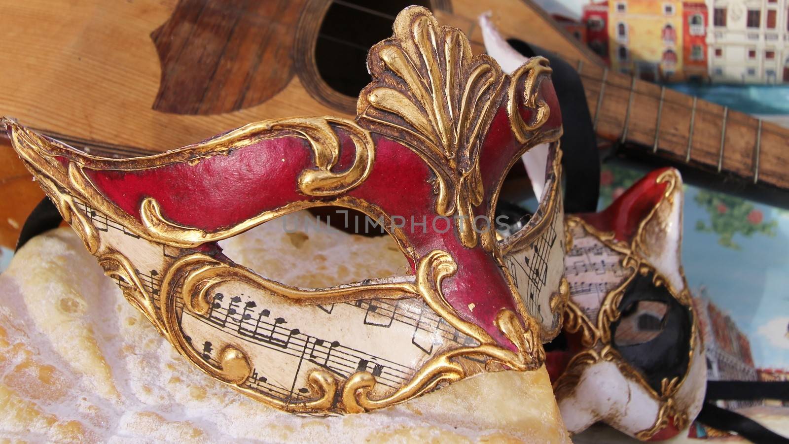 Baroque mask with cat mask and a mandoline.