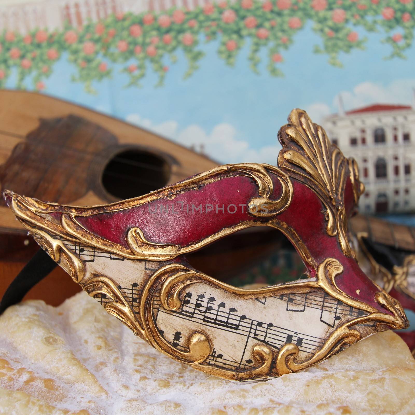 Baroque mask with Venice in background