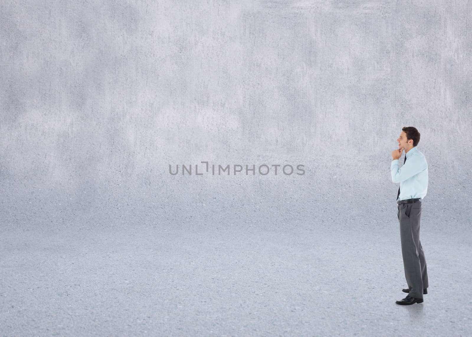 Composite image of thoughtful businessman with hand on chin by Wavebreakmedia