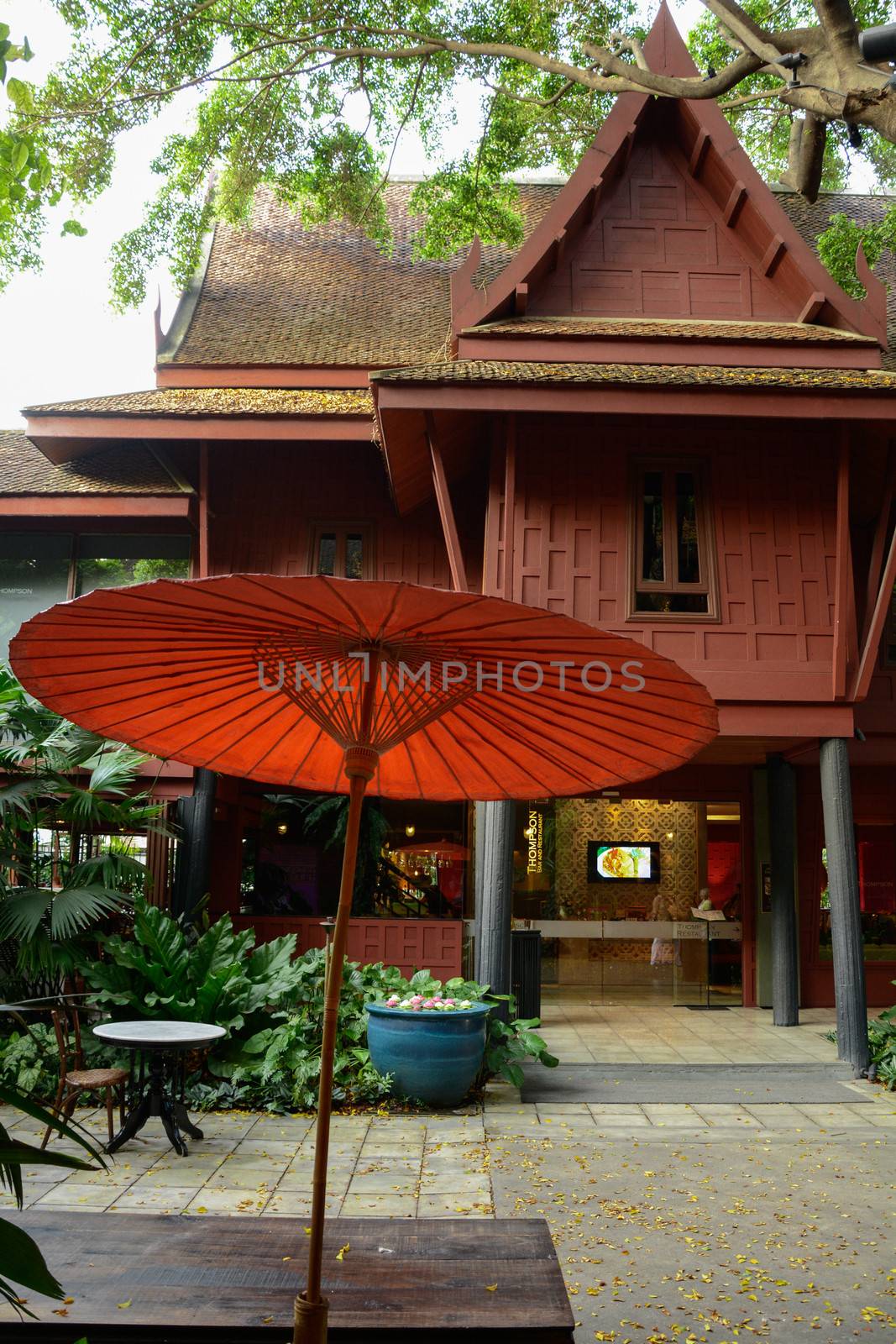 jim thompson house is thai house art style with orange Umbrella by frihuttaya