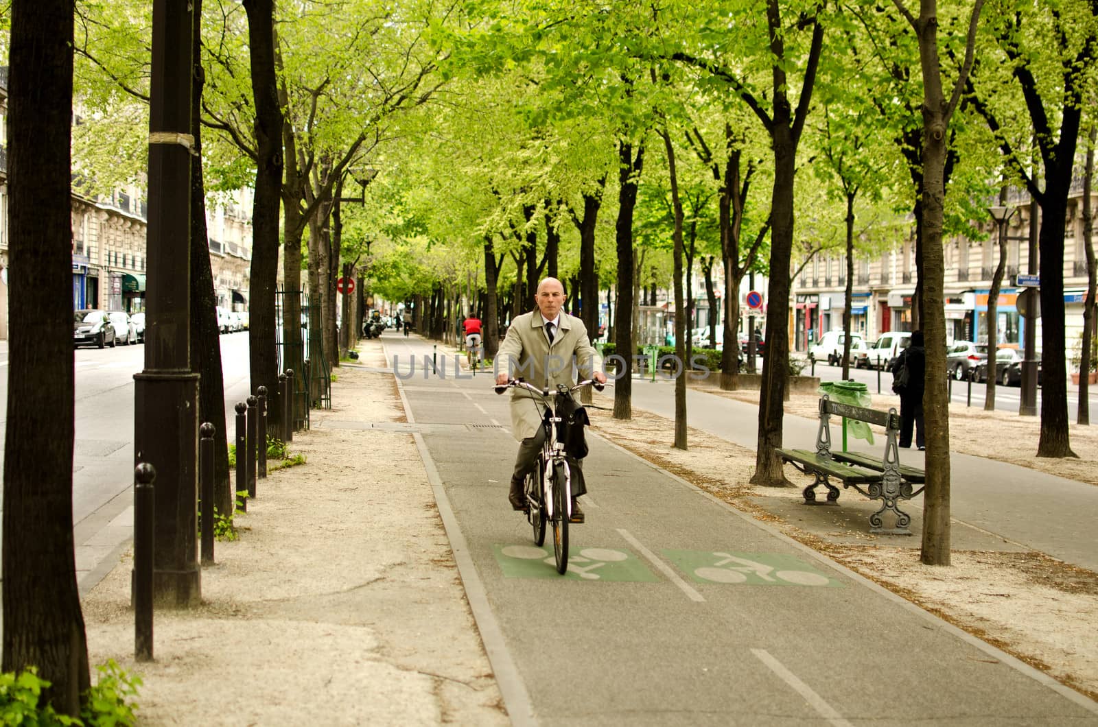Man on bike, Paris by lauria