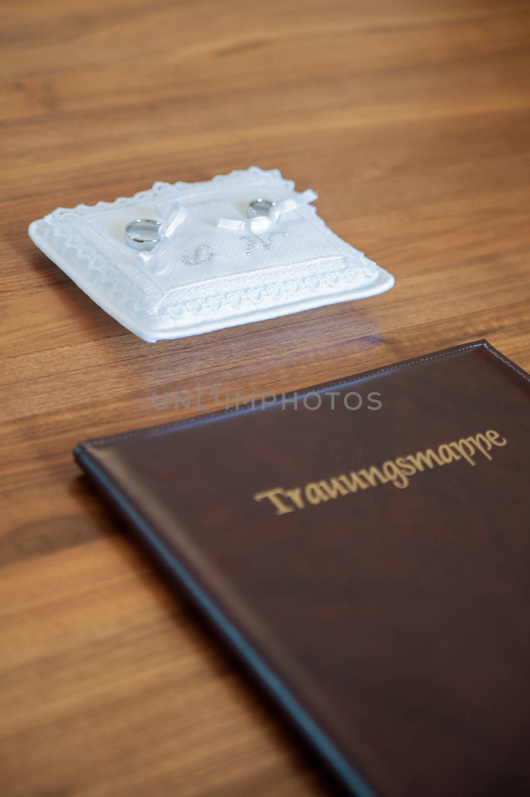 Wedding book with golden letters and rings