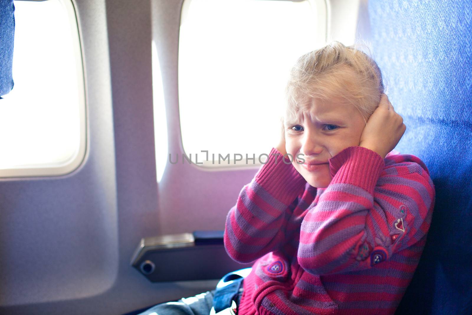 child crying in the airplane by vsurkov