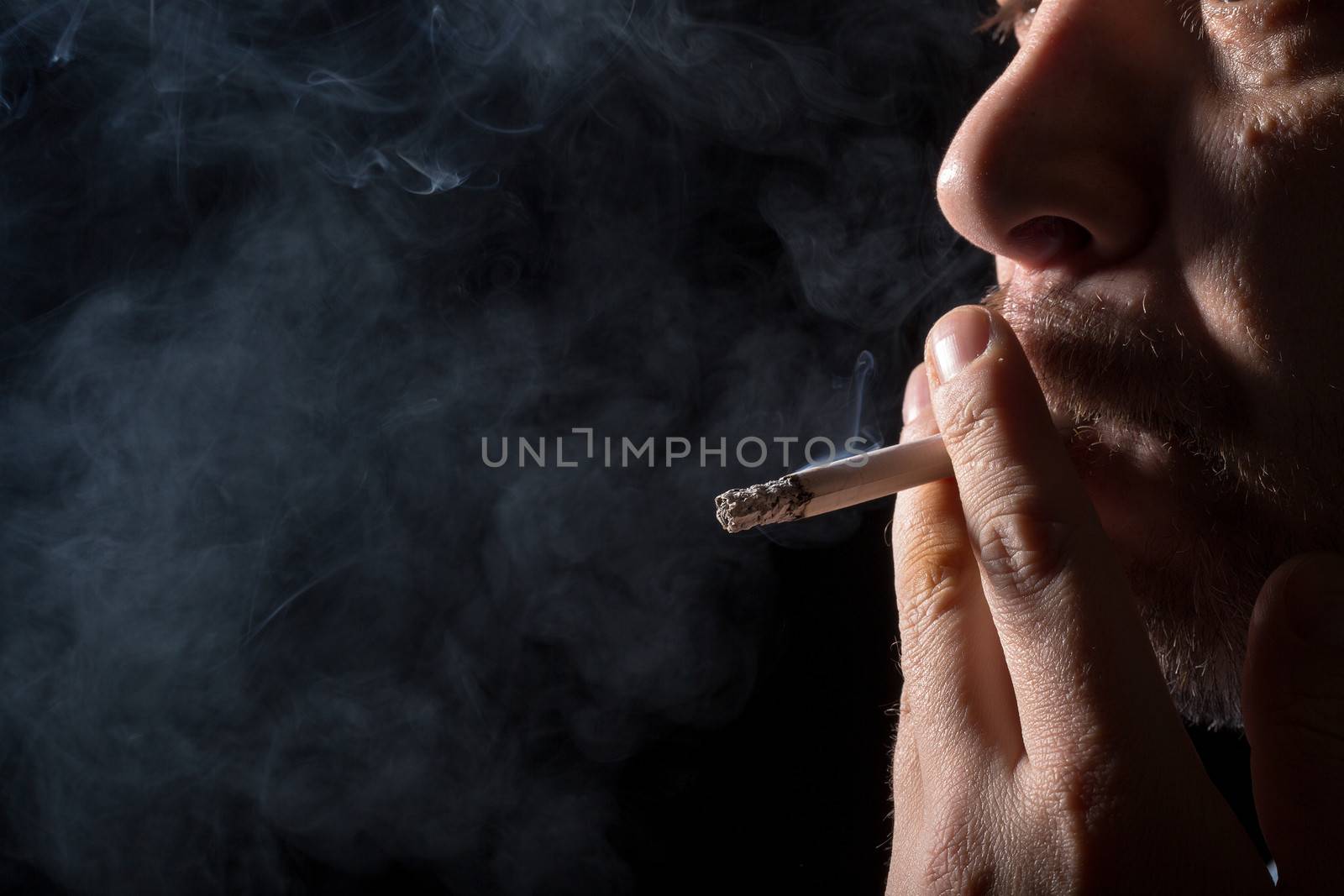 Portrait man smoking cigarette by Discovod