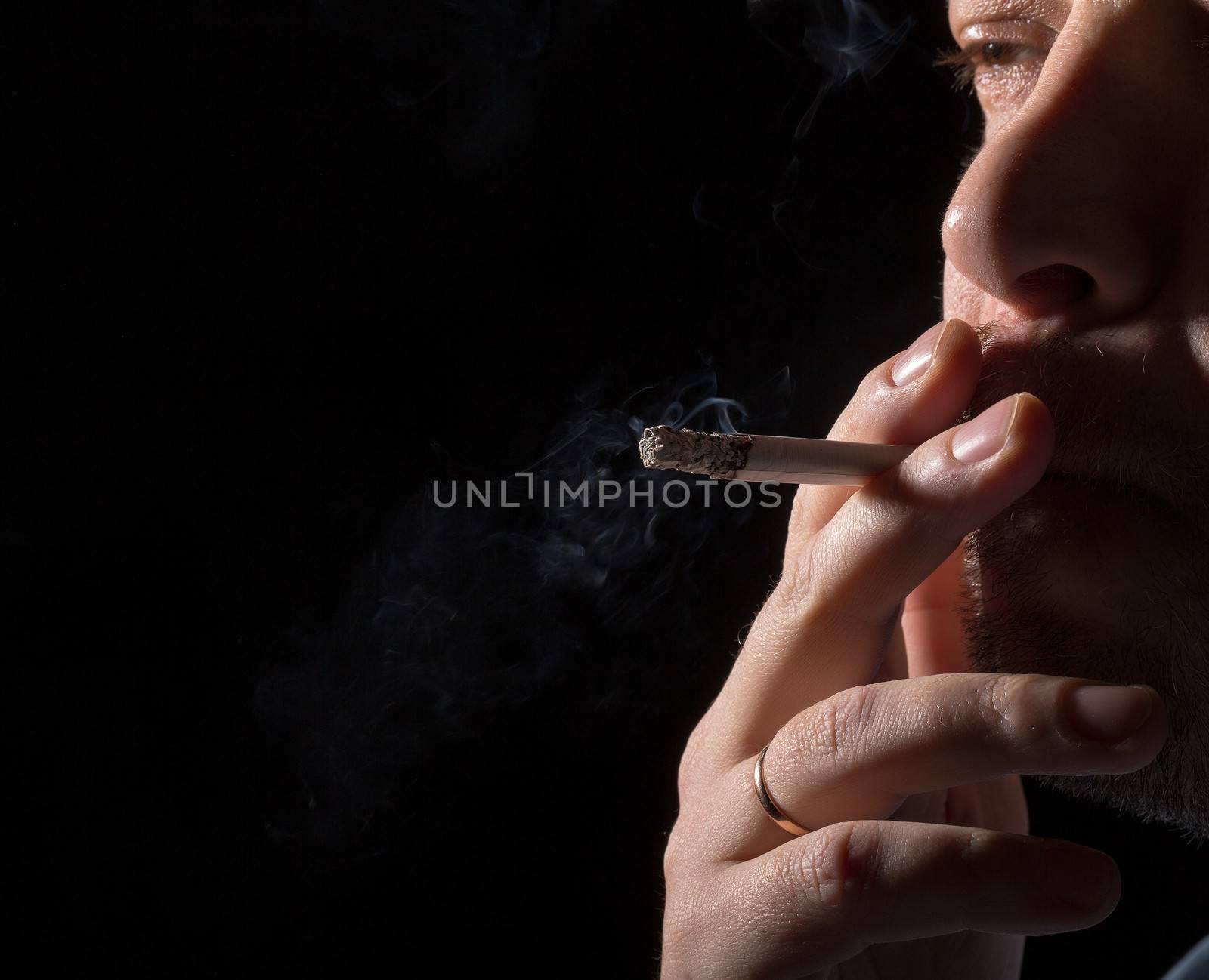 Portrait man smoking cigarette by Discovod