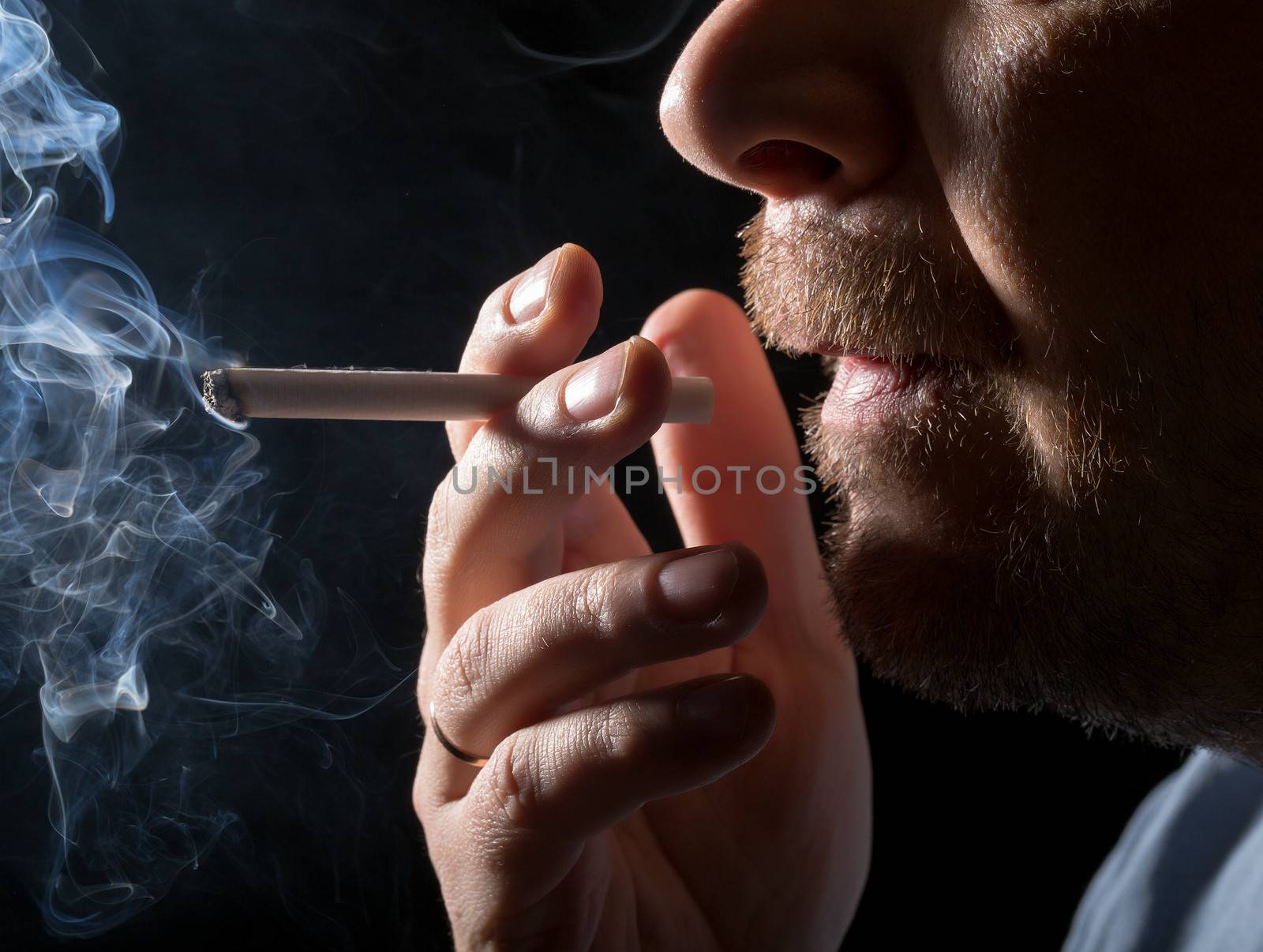 Portrait man smoking cigarette by Discovod