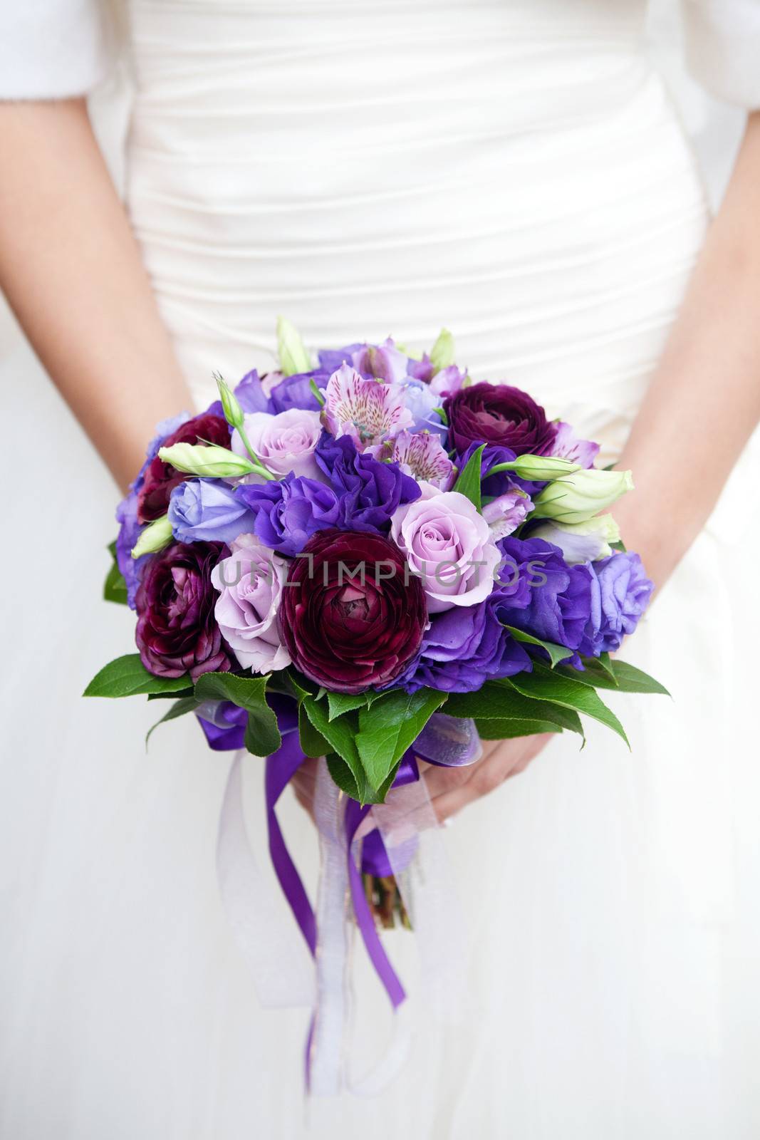 hands on wedding bouquet