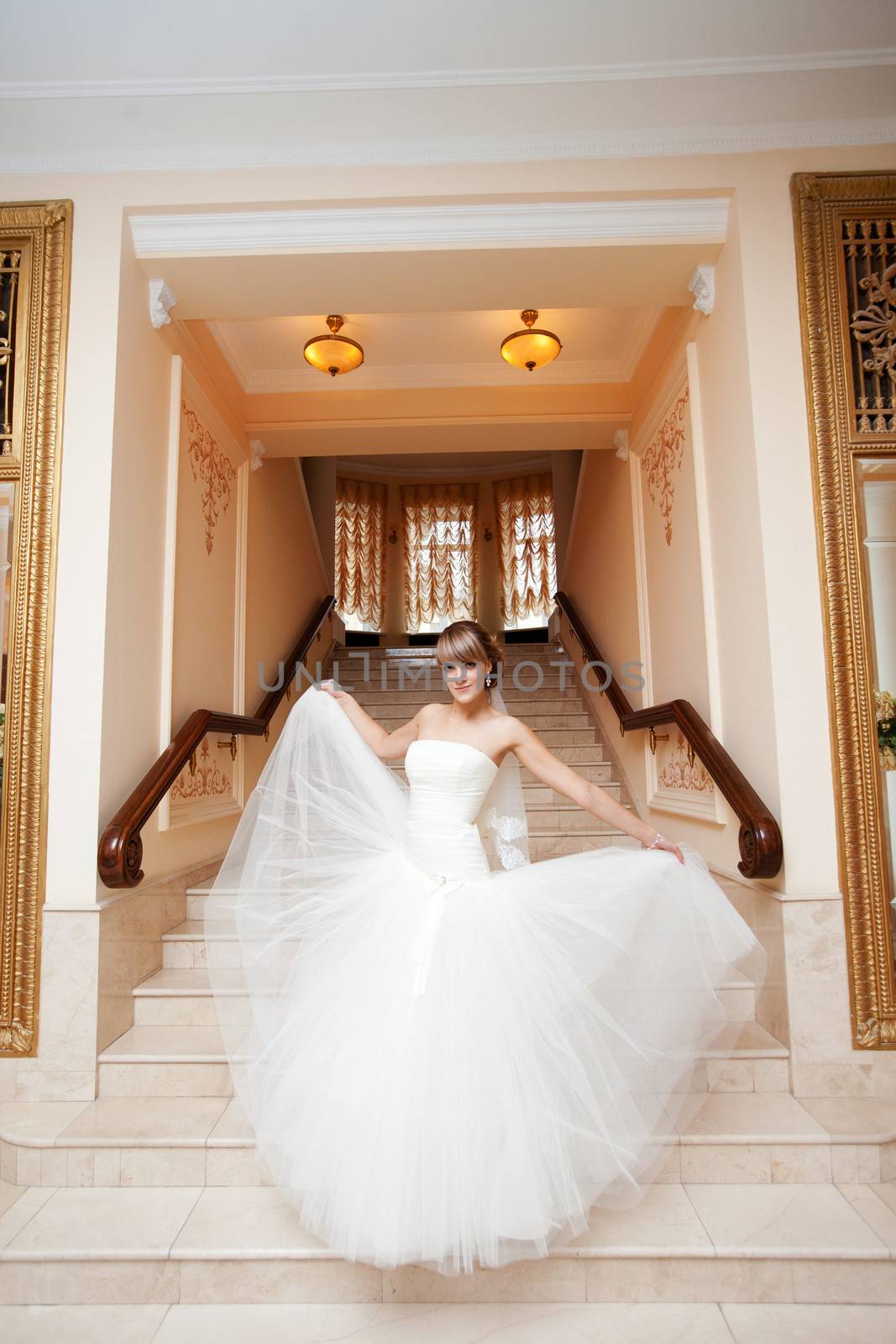 bride in hall with staircase by vsurkov