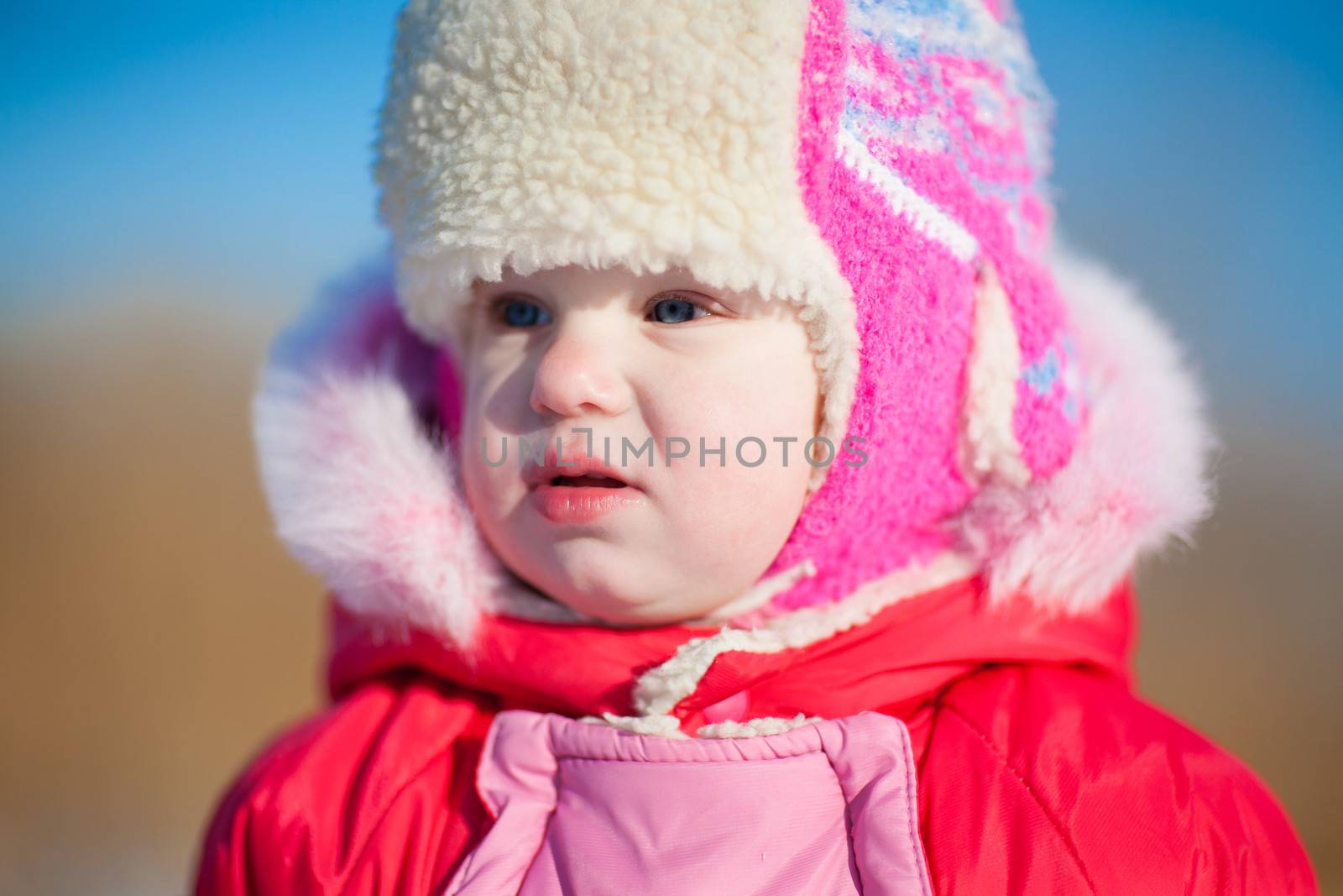 child in winter outdoors by vsurkov