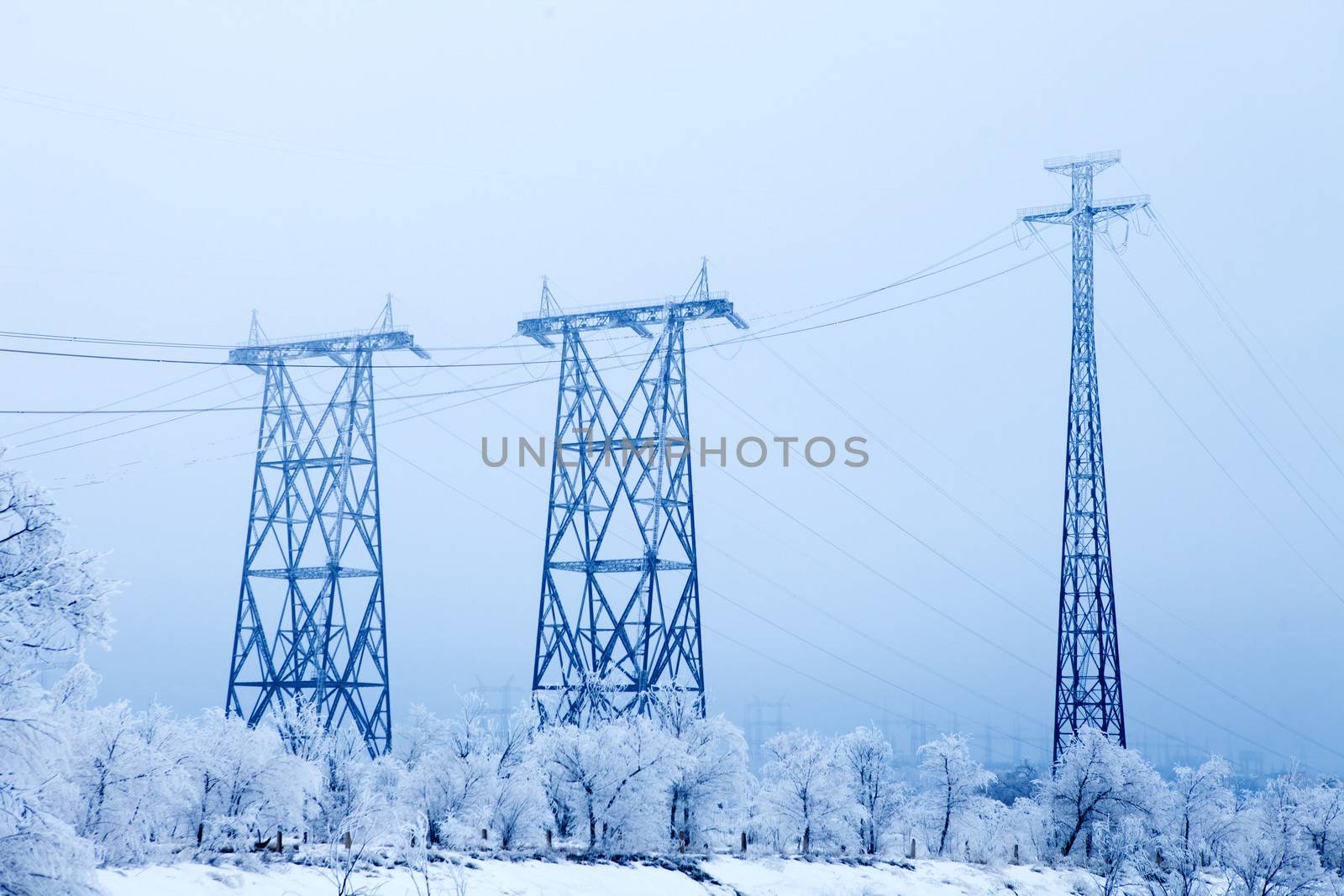 Electrical high-voltage metal pillars in winter by vsurkov