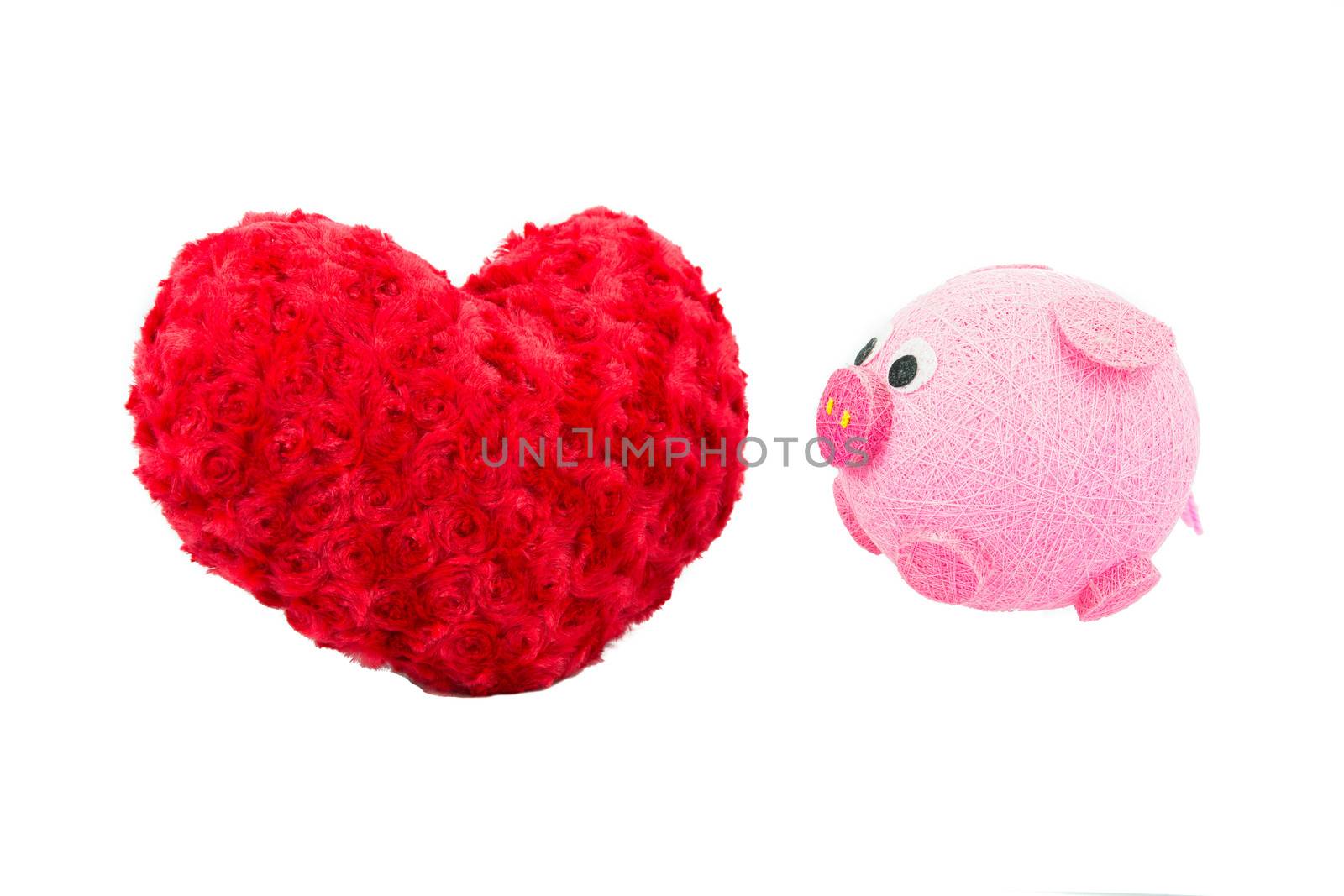 Valentine Heart Made Out of Pillow Roses and Pink Pig on White Background