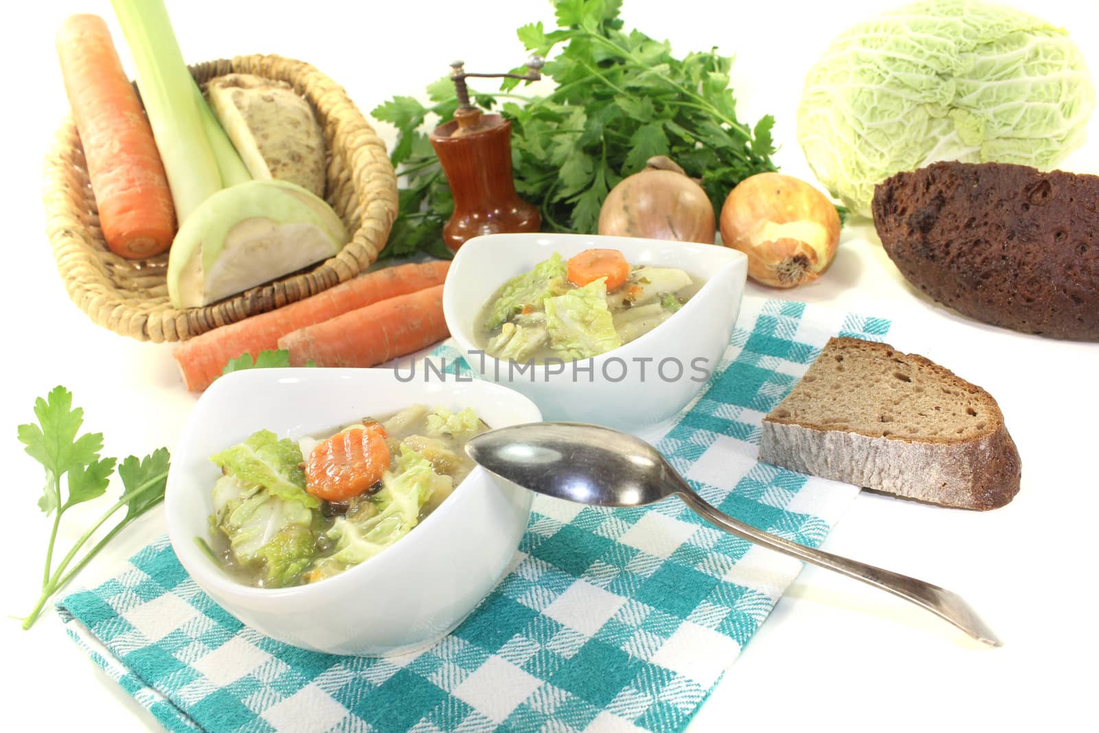 Savoy cabbage stew with carrots on a light background