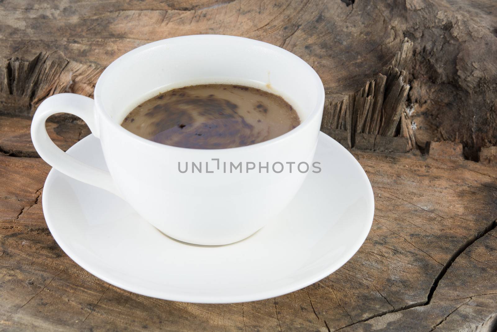 Close up hot coffee drink on wood background