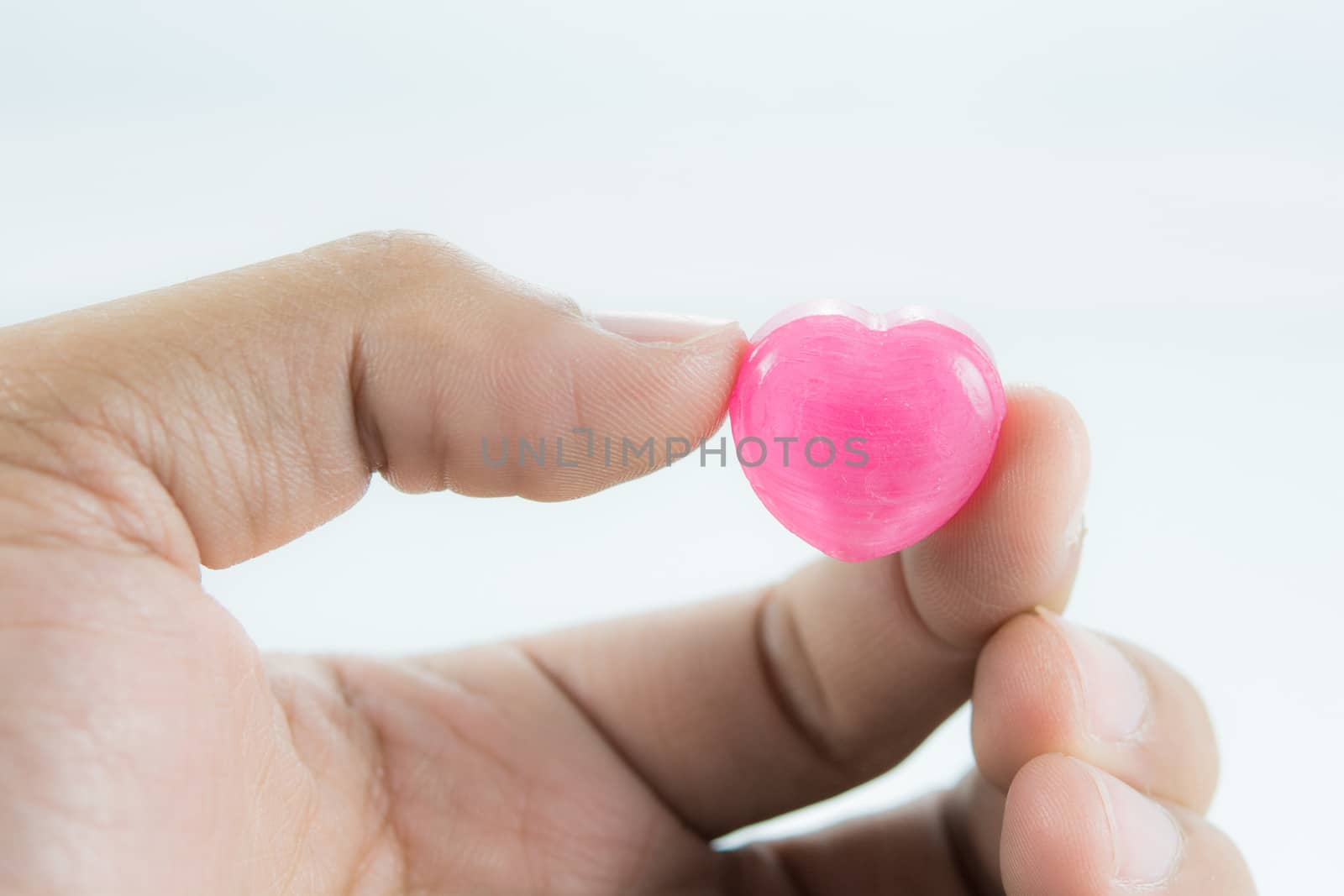 Hands Holding With Love Red Heart on white background