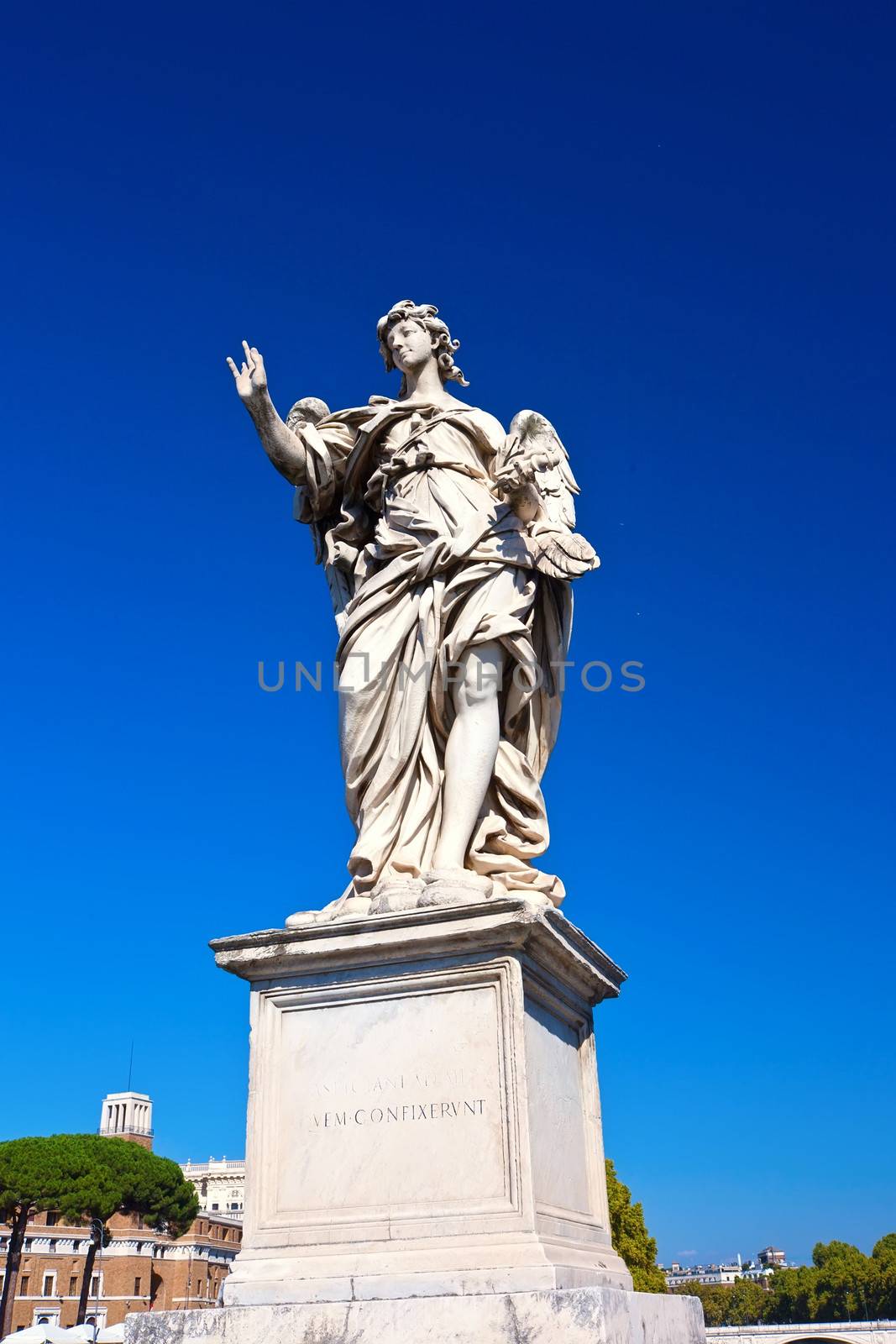Marble statue of angel by Bernini on Saint Angelo Bridge, Rome