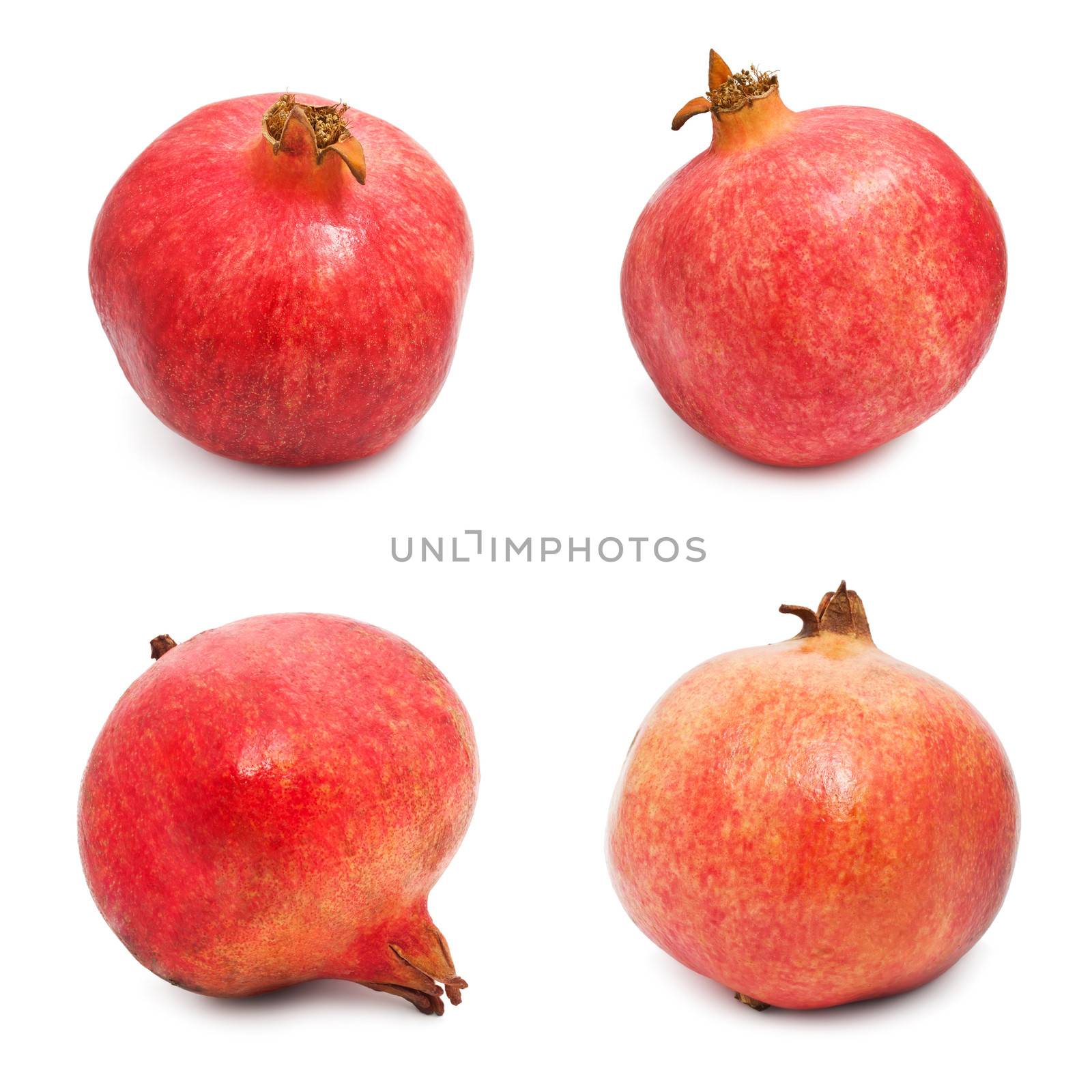 Collection of red pomegranates isolated on white background