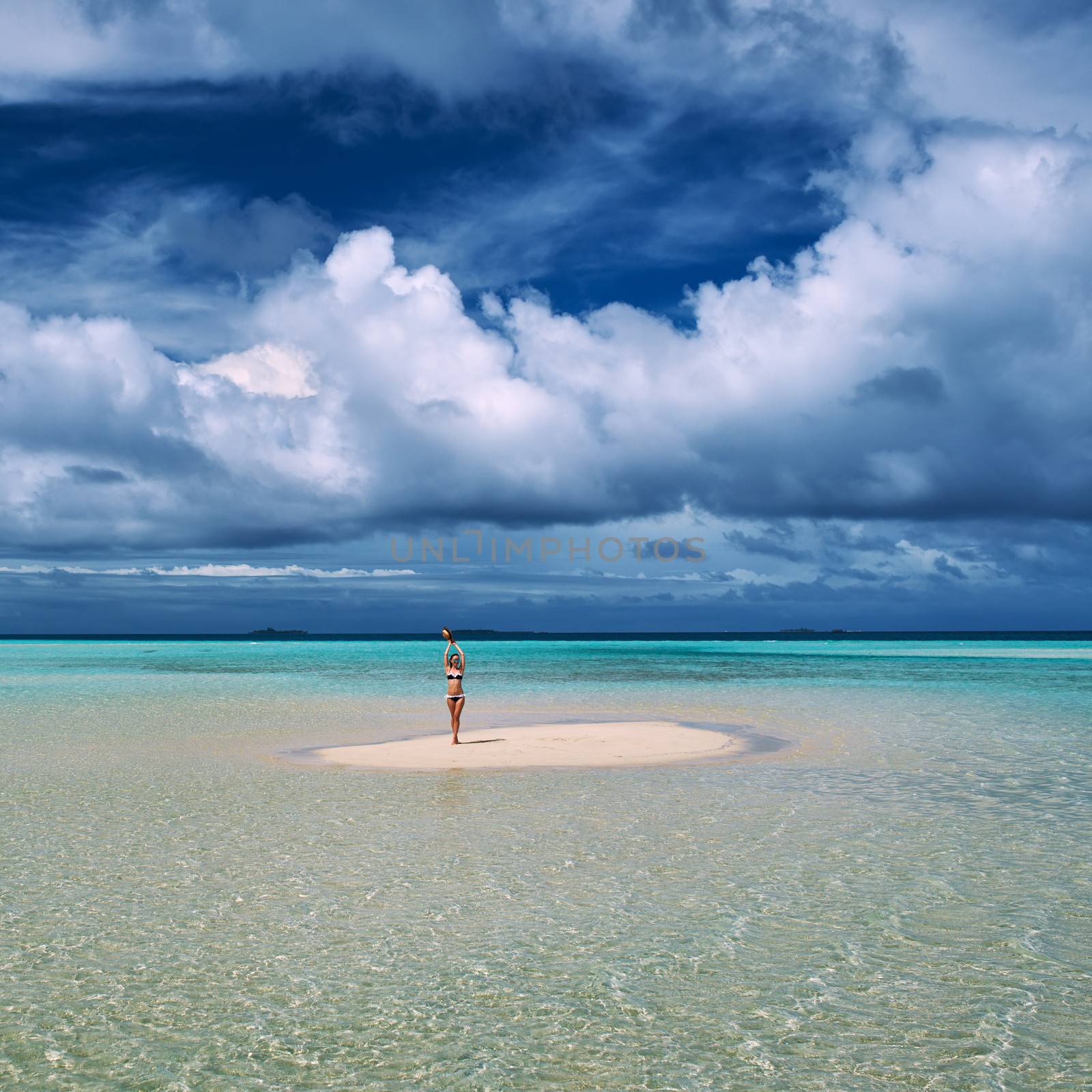 Woman in bikini at tropical beach