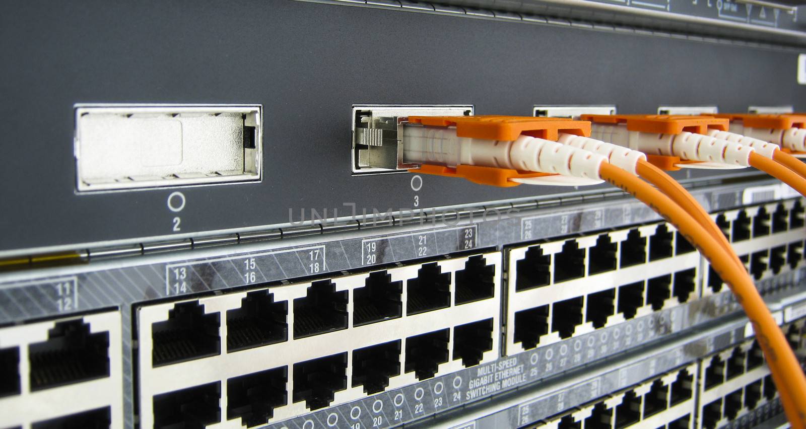 GBIC optic fiber communications equipment installed in a large datacenter.