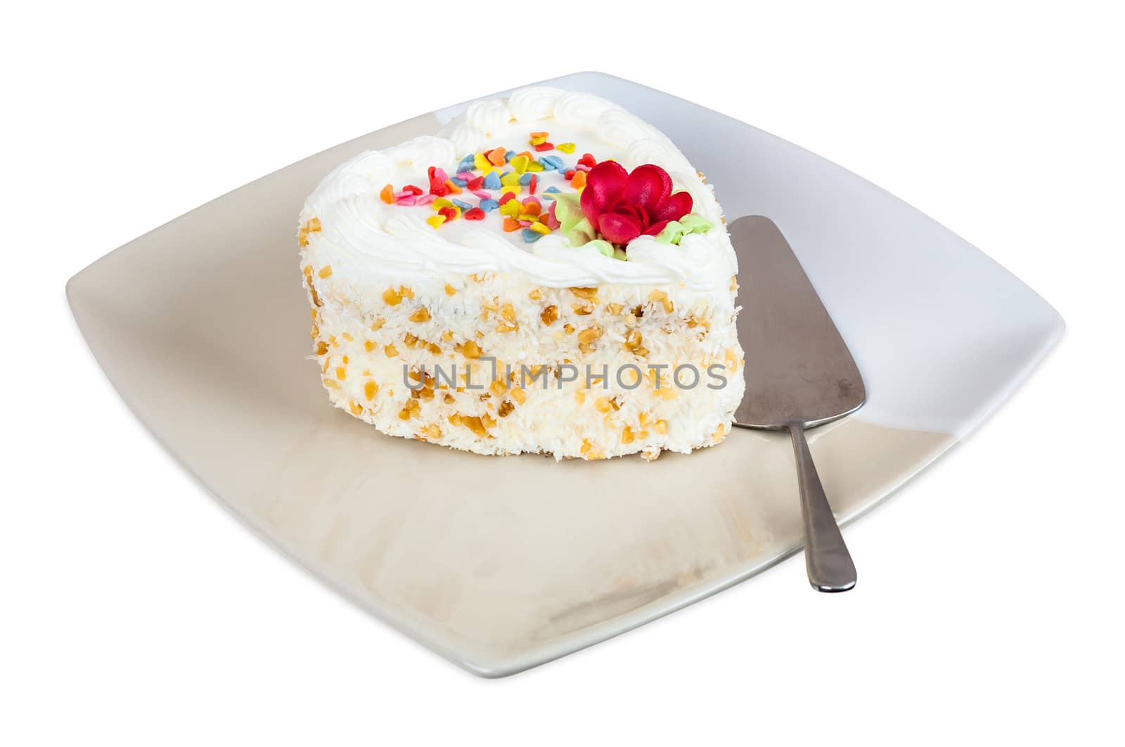 Cake in the shape of heart on plate isolated on white background with clipping path
