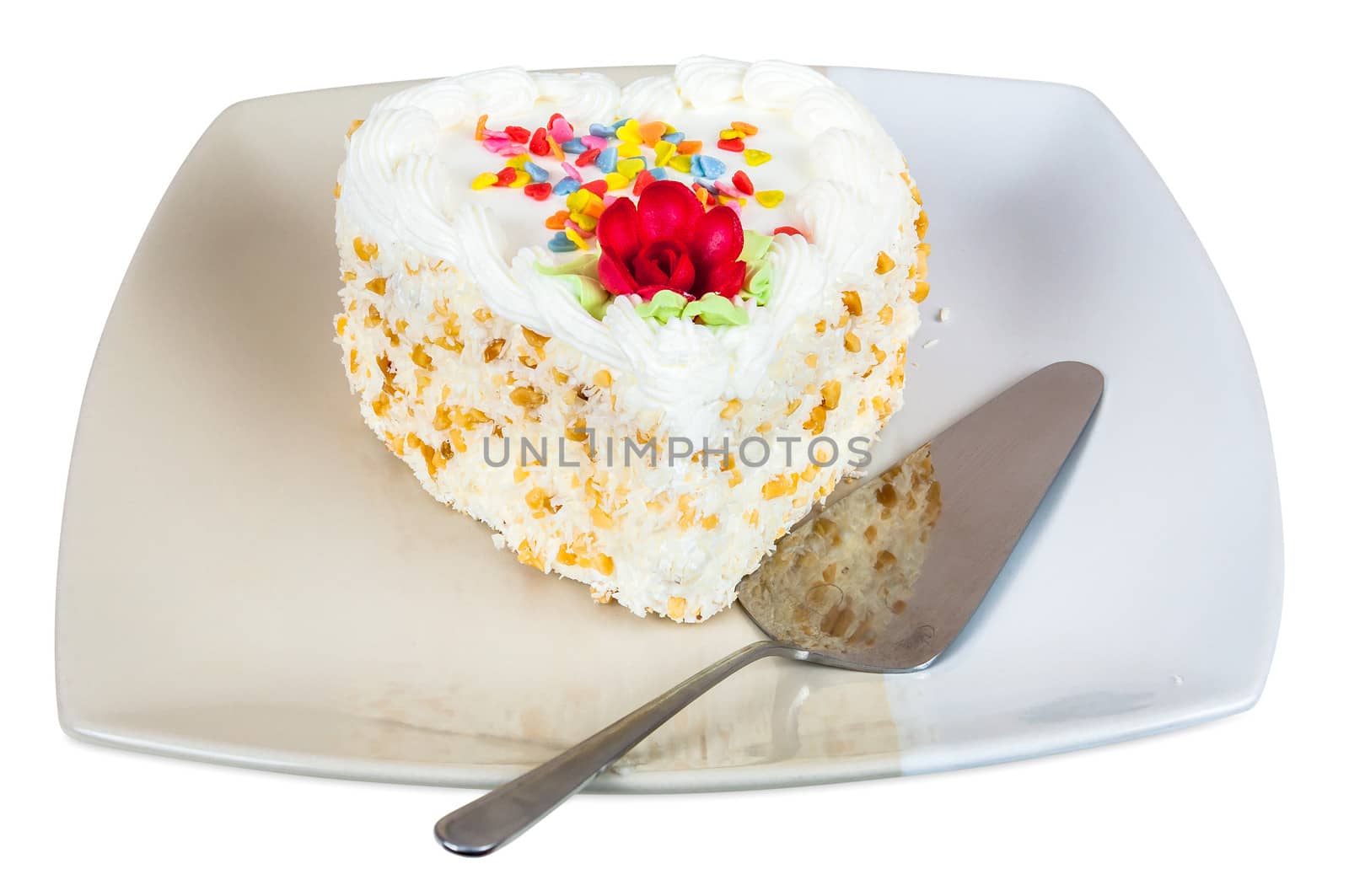Cake in the shape of heart on plate by mkos83