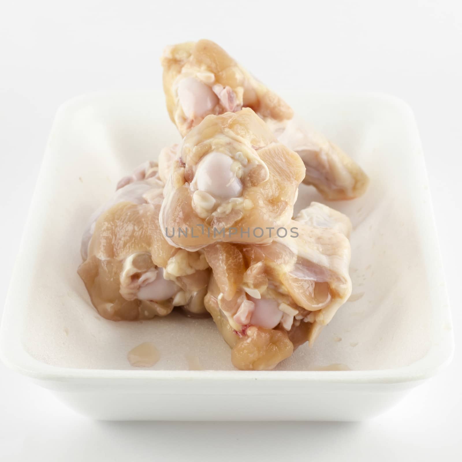 food fresh chicken in foam isolated on white background