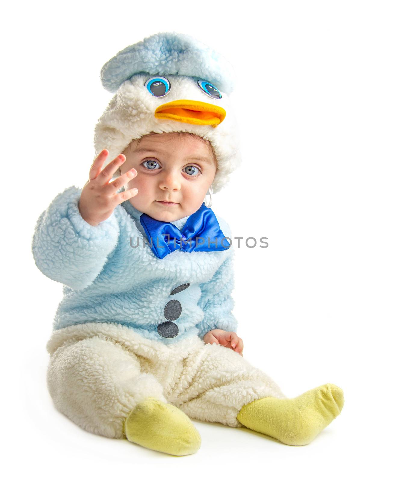 Baby in duck suit posing at camera on white background