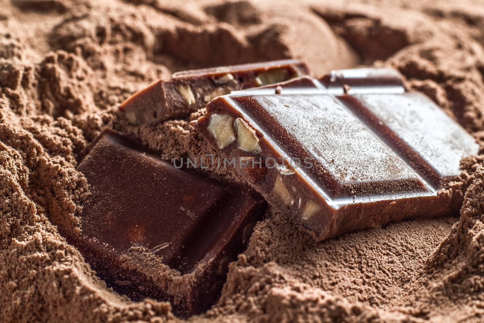 Several pieces of chocolate with hazelnut