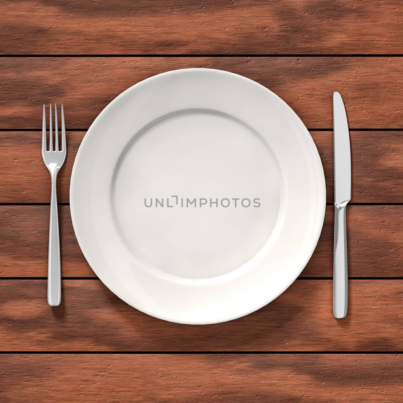 Knife, fork and white dish on the dining table