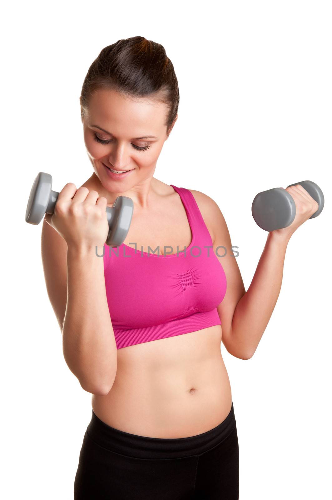 Woman working out with dumbbells at a gym, isolated in a white background