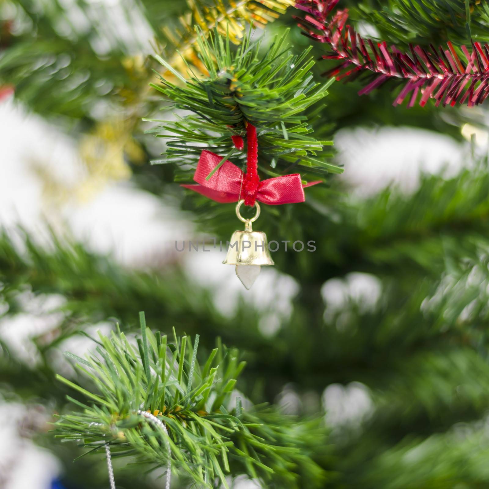 small bell on christmas tree isolated on white  by ammza12