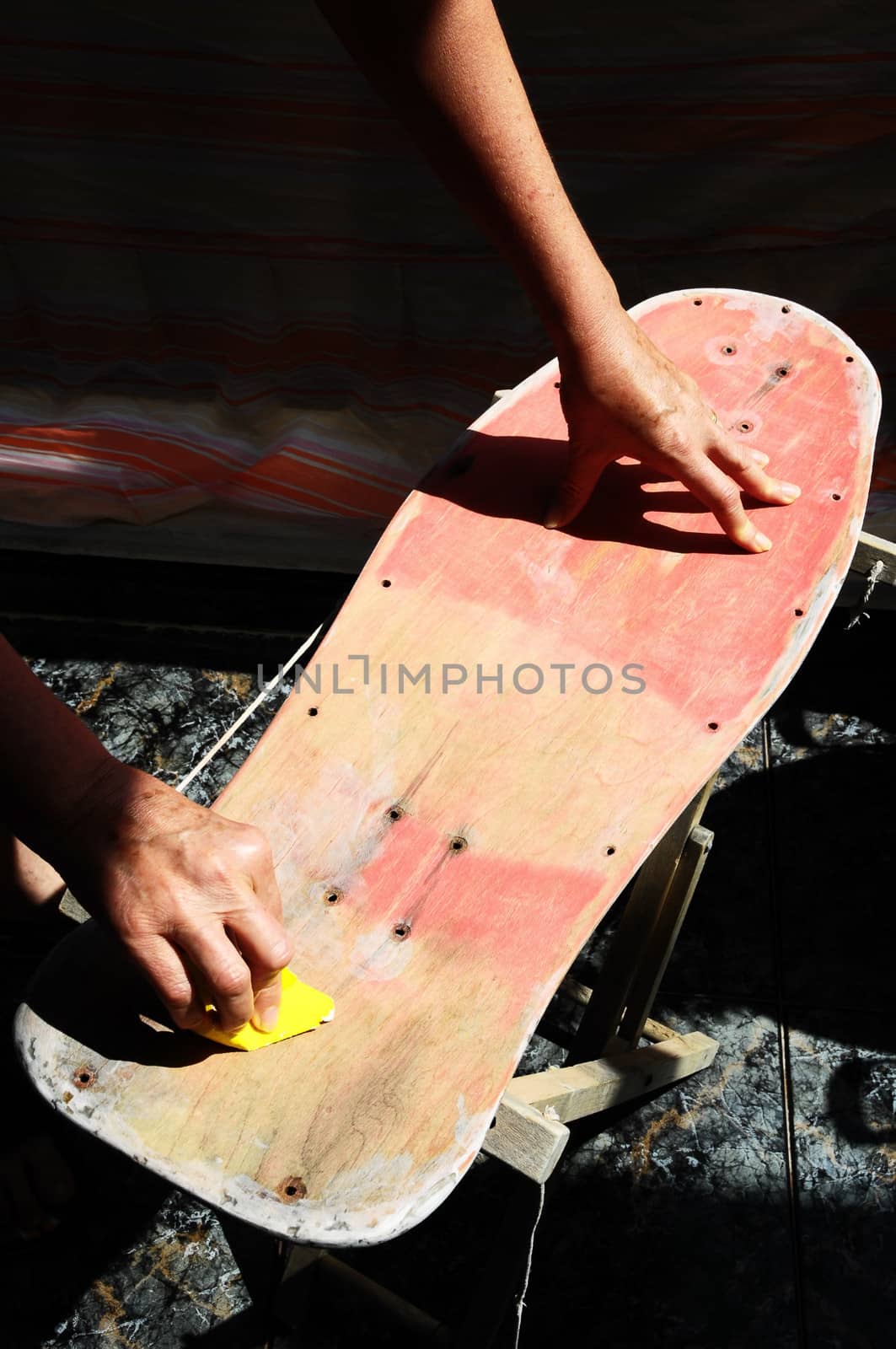 Restore an Old Skateboard with a Yellow Sandpaper