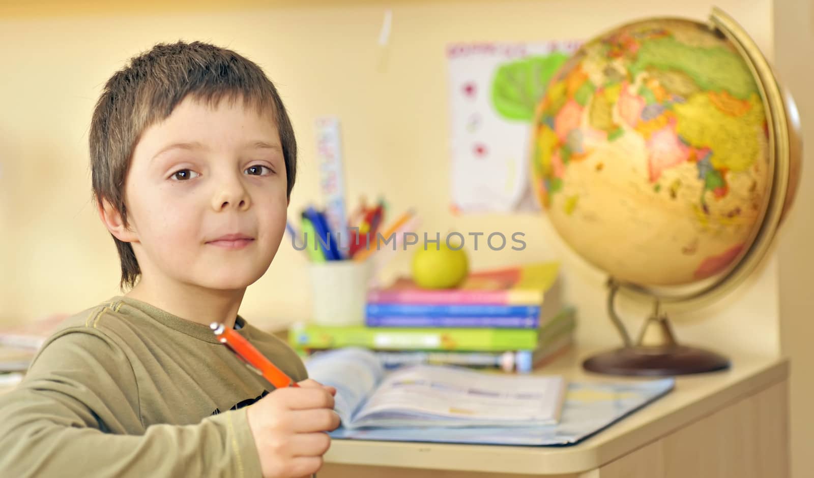 boy  doing homework in his room