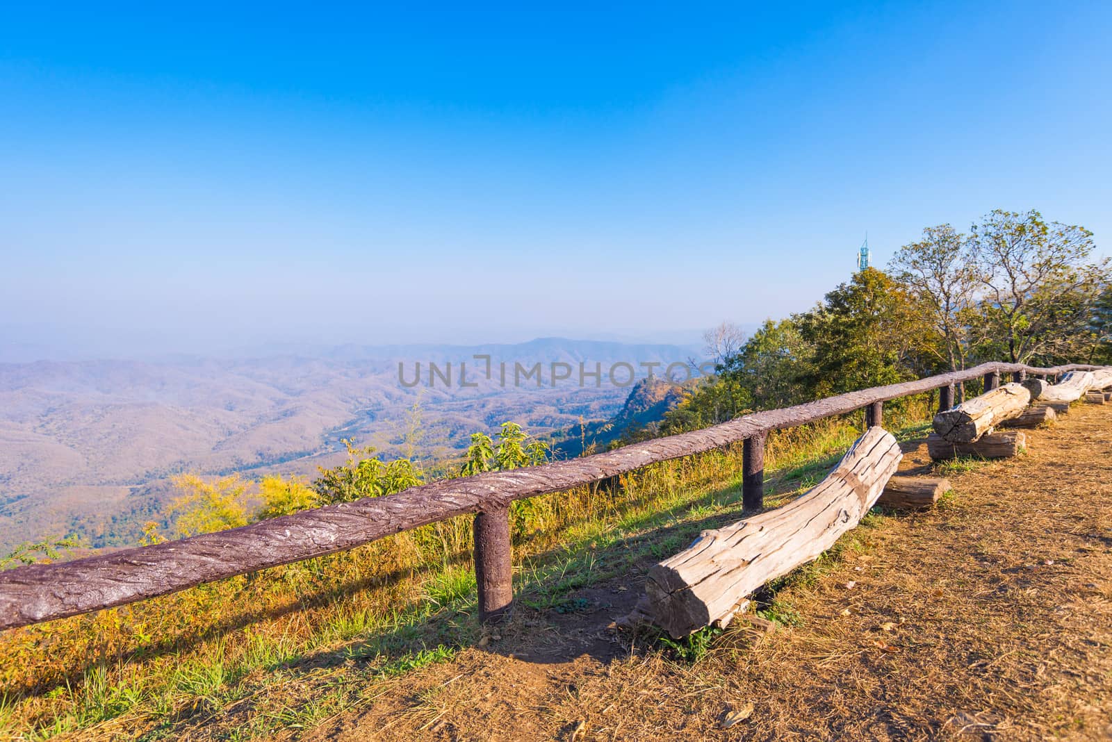 old log wood chair with wood fence on view point lanscape