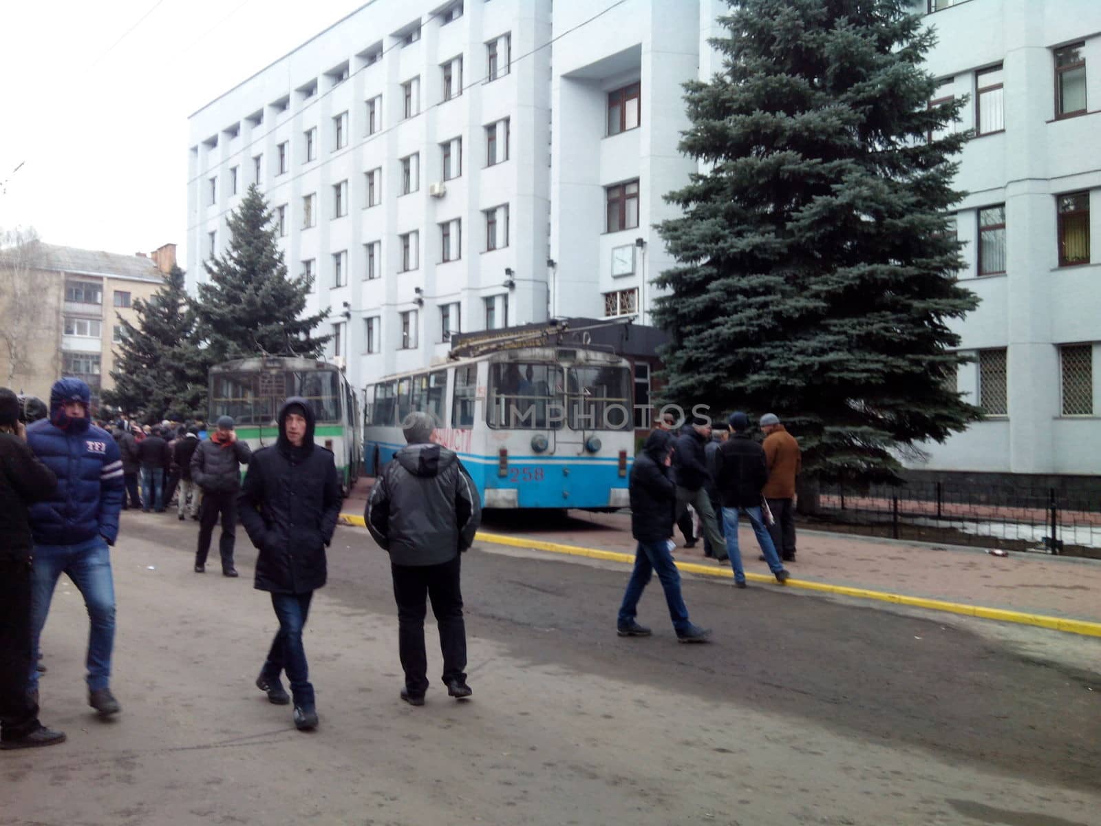 KHMELNYTSKY, UKRAINE - FEBRUARY 18: Unidentified protesters during Ukrainian revolution. Three people were injured in shooting during protest near Security Service of Ukraine building on February 18,  2014 in Khmelnytsky, Ukraine