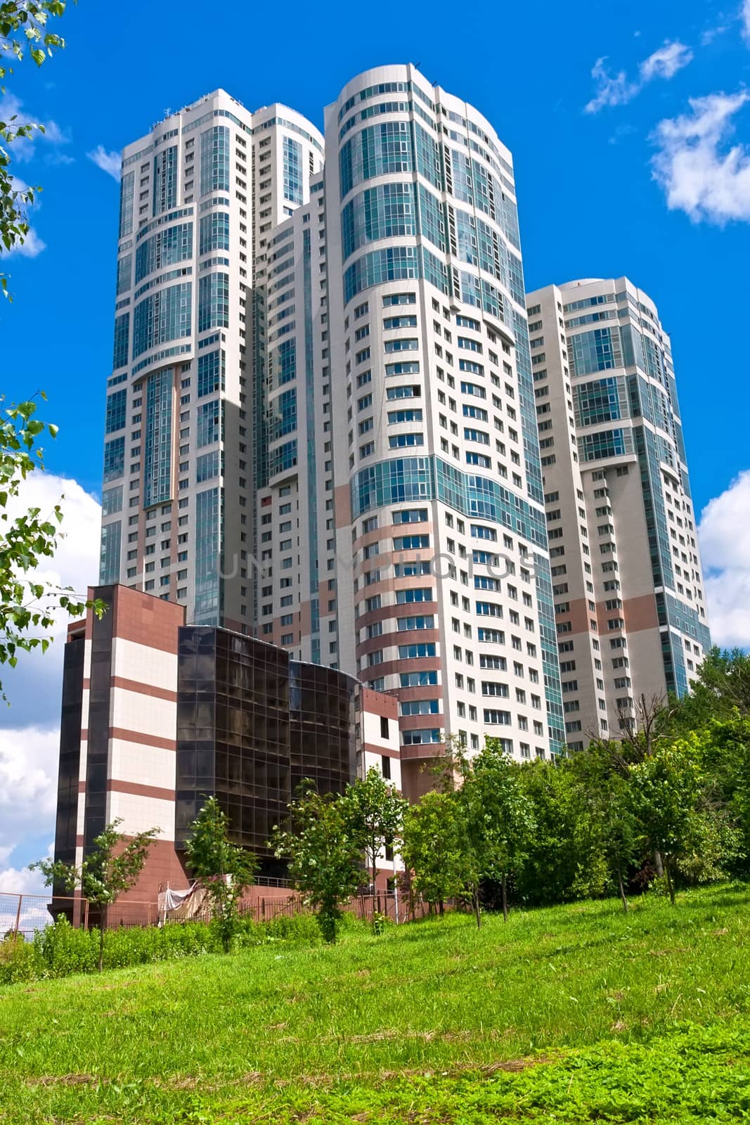 Beautiful view of modern apartment buildings under blue sky