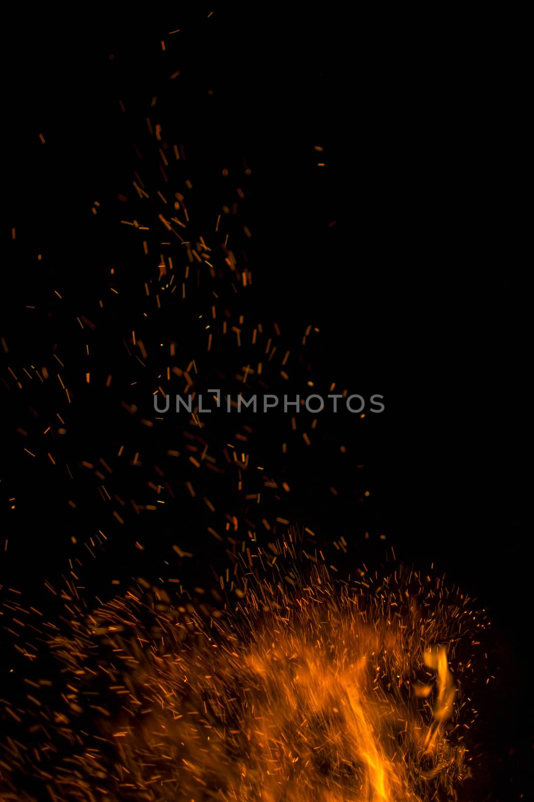 Orange sparks on a black background by Irene1601