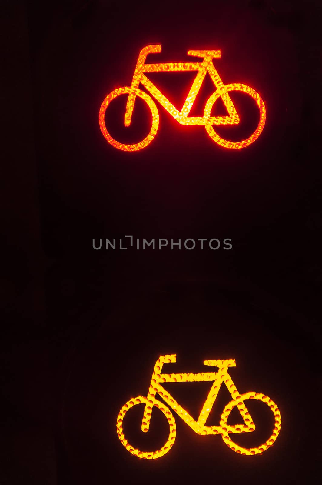 bicycle signs on a traffic light