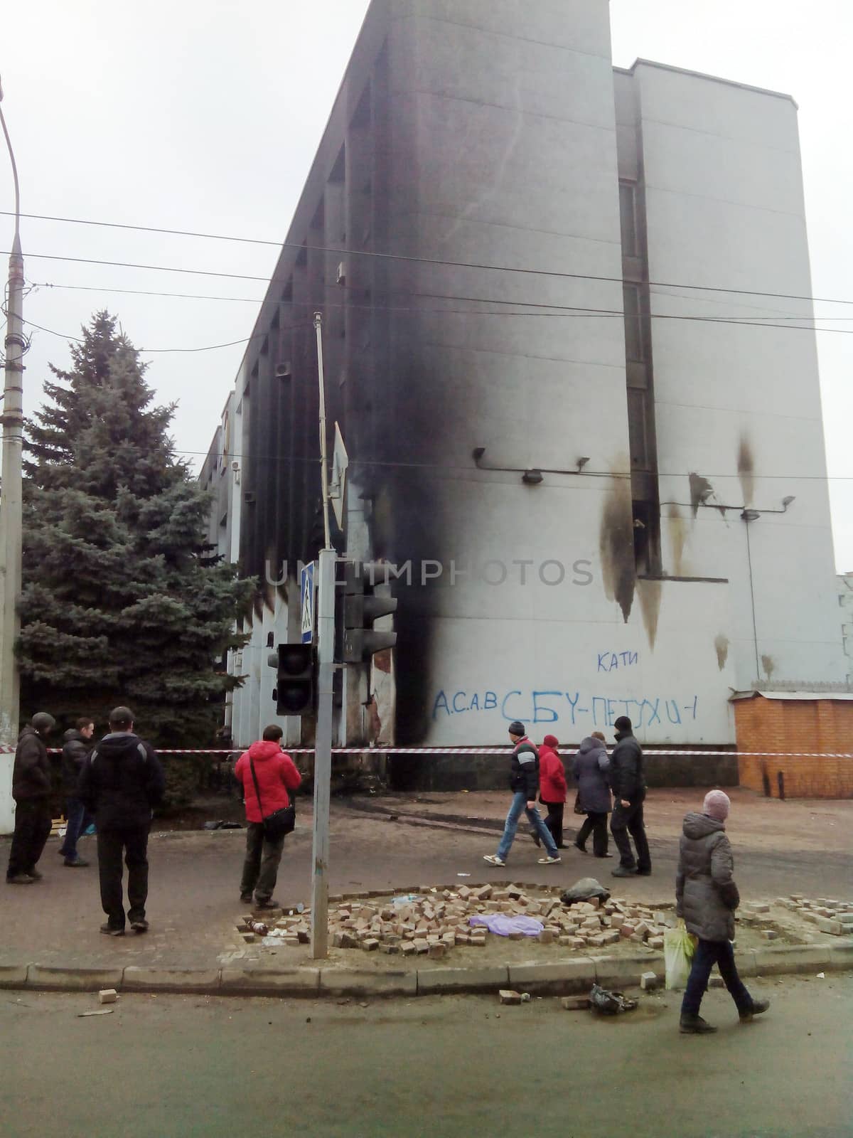 KHMELNYTSKY, UKRAINE - FEBRUARY 20: Unidentified protesters near burned Ukraine Security Service department. One man killed and five were injured in shooting on February 20,  2014 in Khmelnytsky, Ukraine
