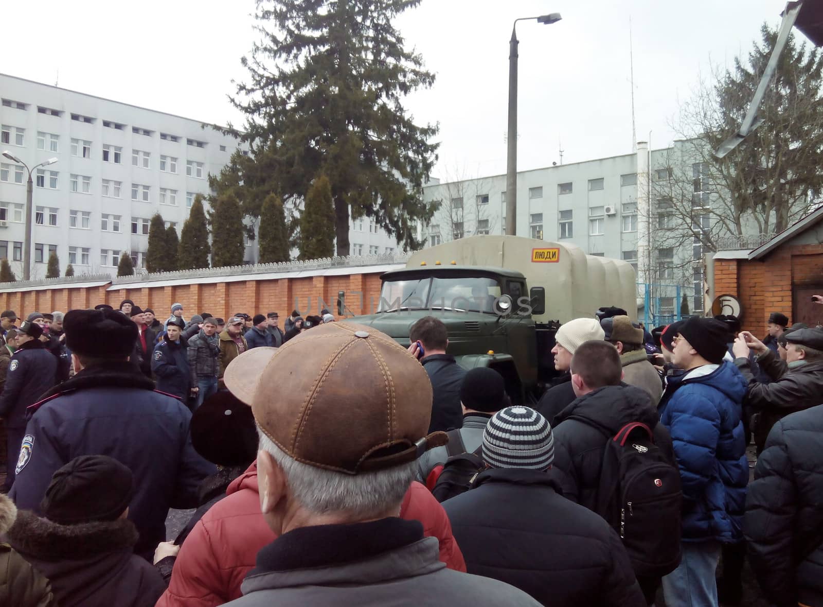 KHMELNYTSKY, UKRAINE - FEBRUARY 20: Unidentified protesters near burned Ukraine Security Service department. One man killed and five were injured in shooting on February 20,  2014 in Khmelnytsky, Ukraine