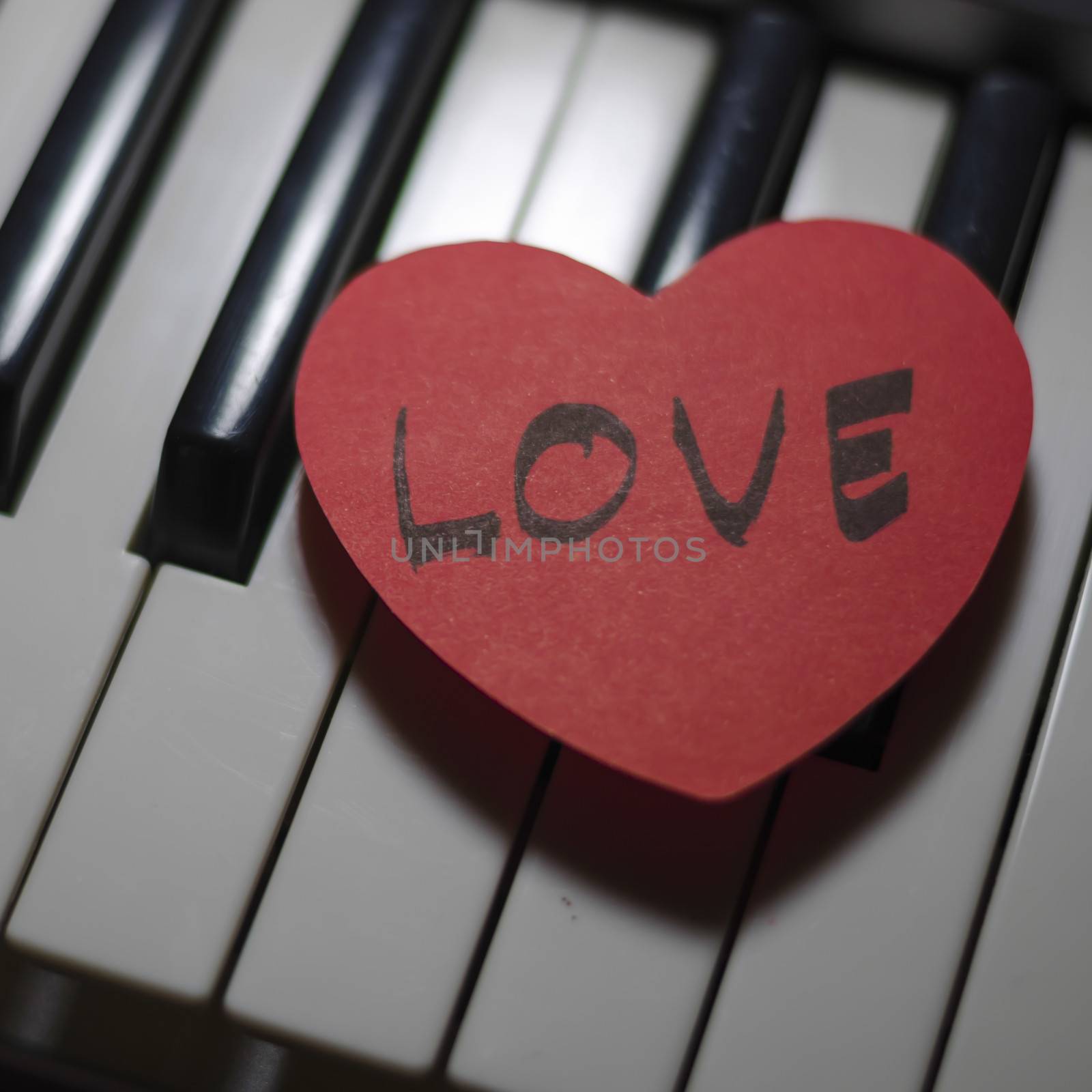 heart on key piano say love music