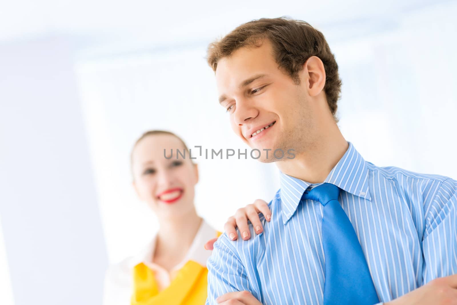 Businessman receiving congratulations from his colleagues in the leadership team work