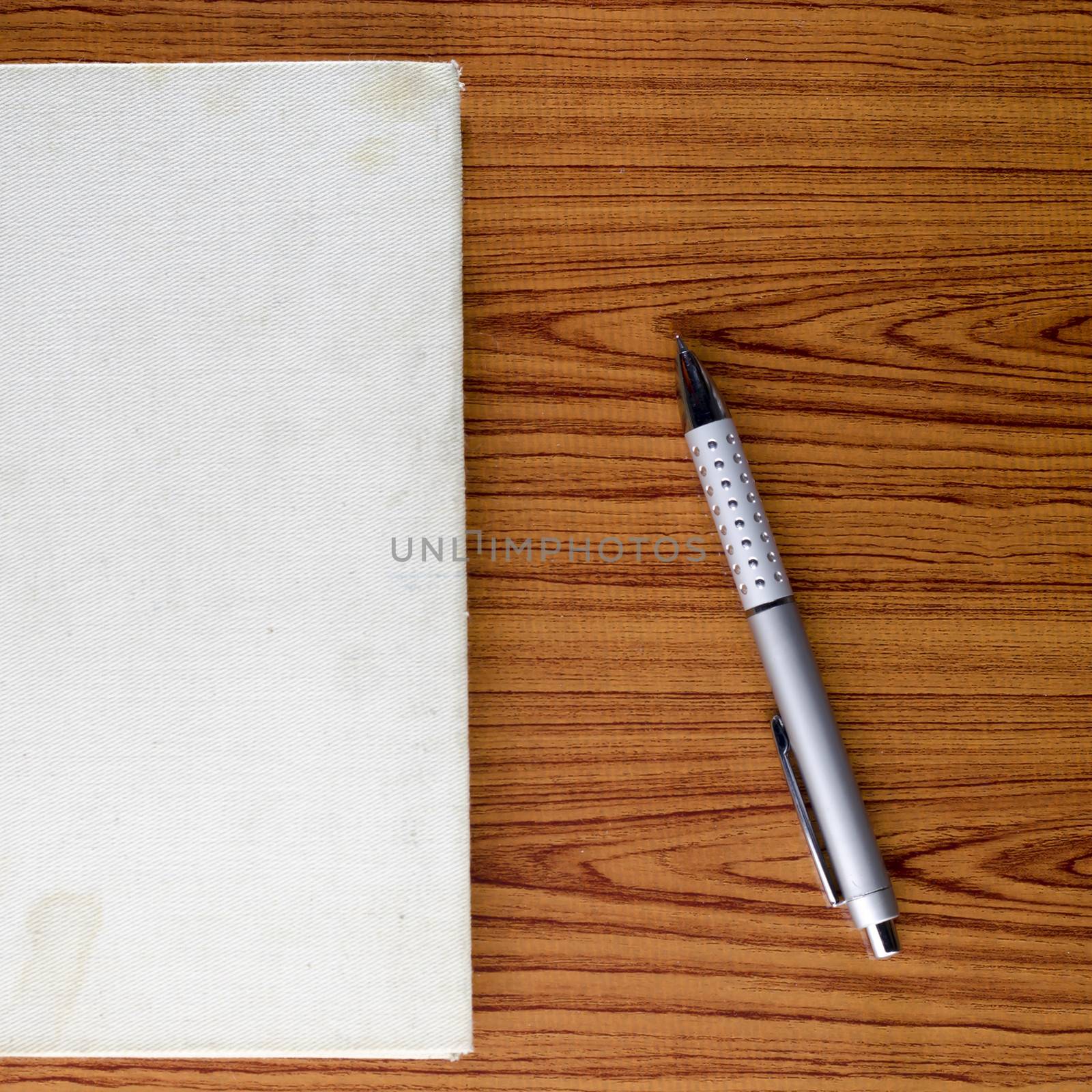 notebook on wood background