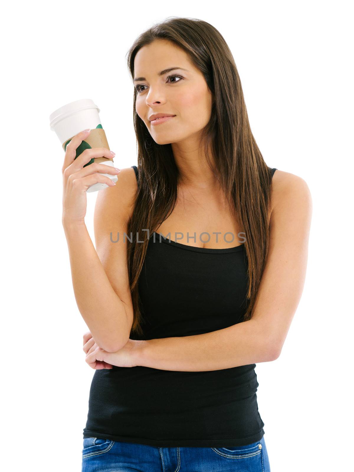 Photo of a beautiful brunette woman drinking a takeout coffee. 