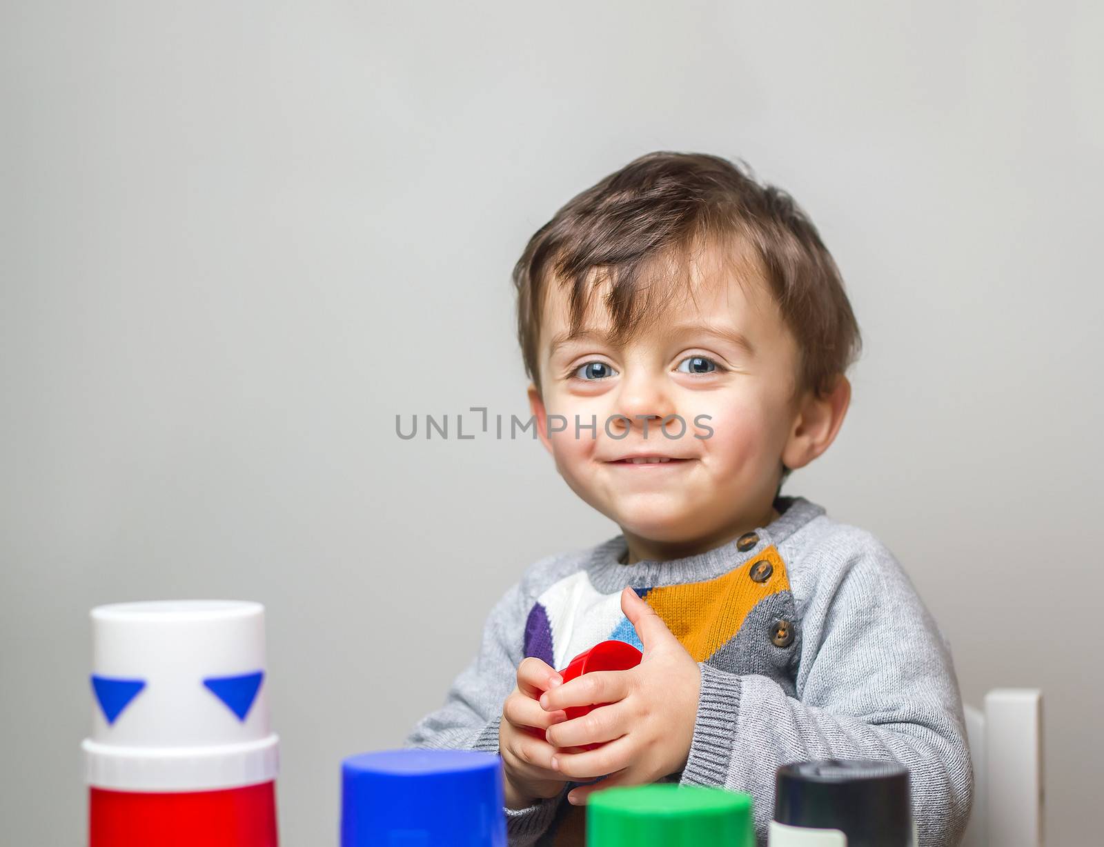 Child smiling to the camera by dynamicfoto