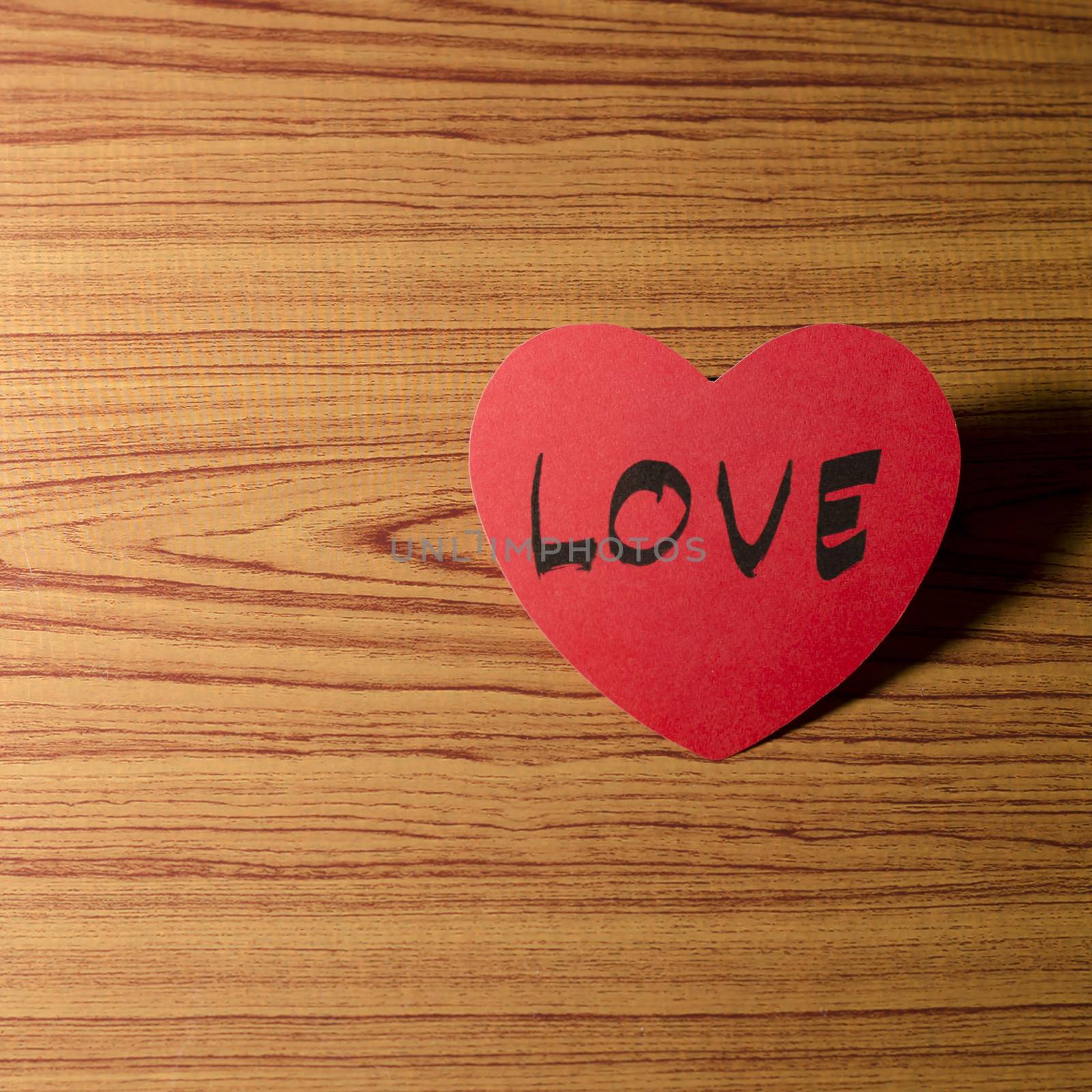 red heart word LOVE on wood vintage stlye background